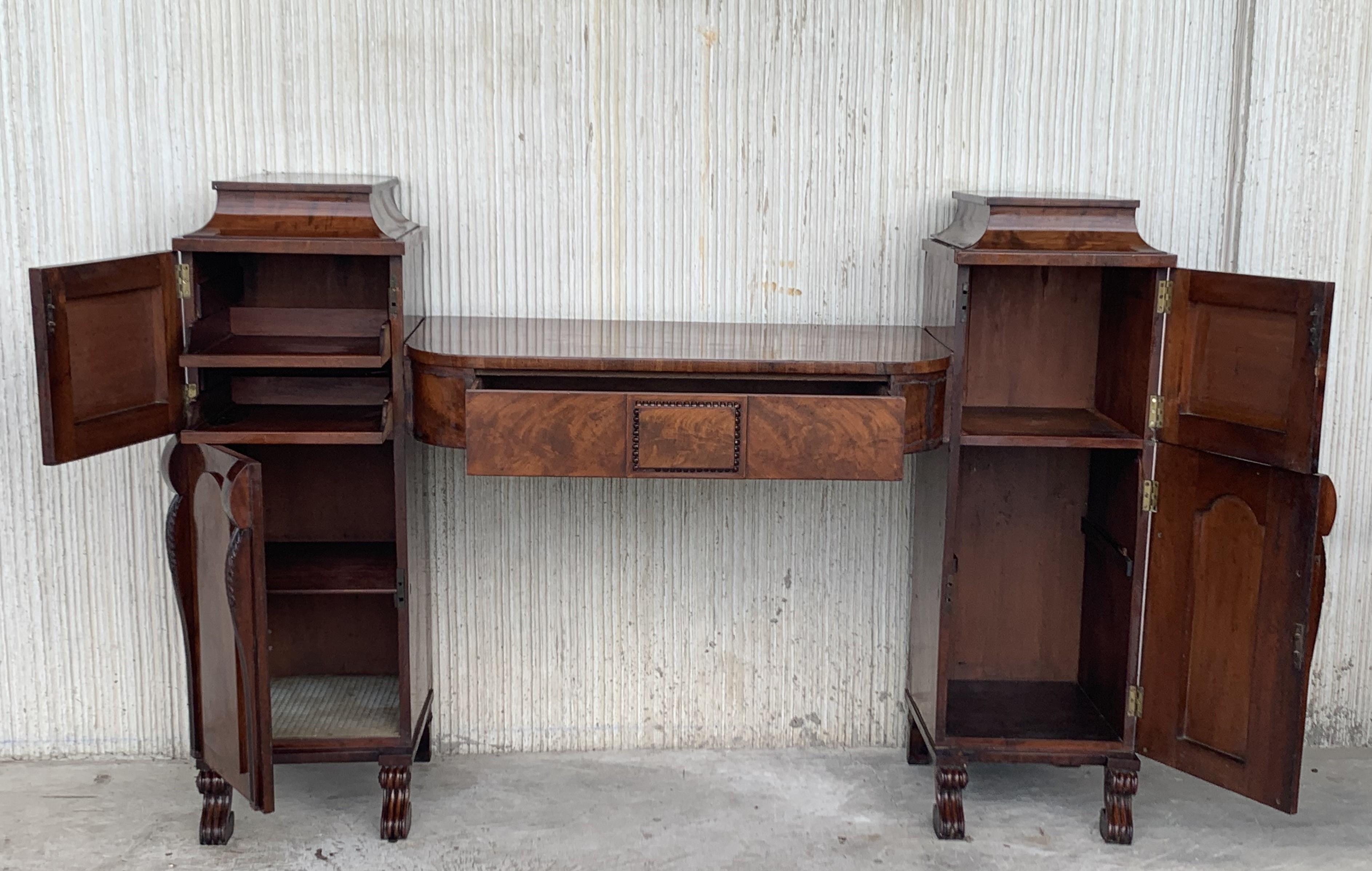 Mahogany veneered Biedermeier vanity desk with two pilaster as well as columns at the front with ebonized bases and capitals. The doors are opened via a pressure mechanism. The tabletop has a drawer and the interior columns consists of several