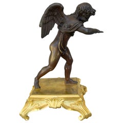 "Amour aveugle" Statuette en bronze patiné de Cupidon cherchant l'amour les yeux bandés