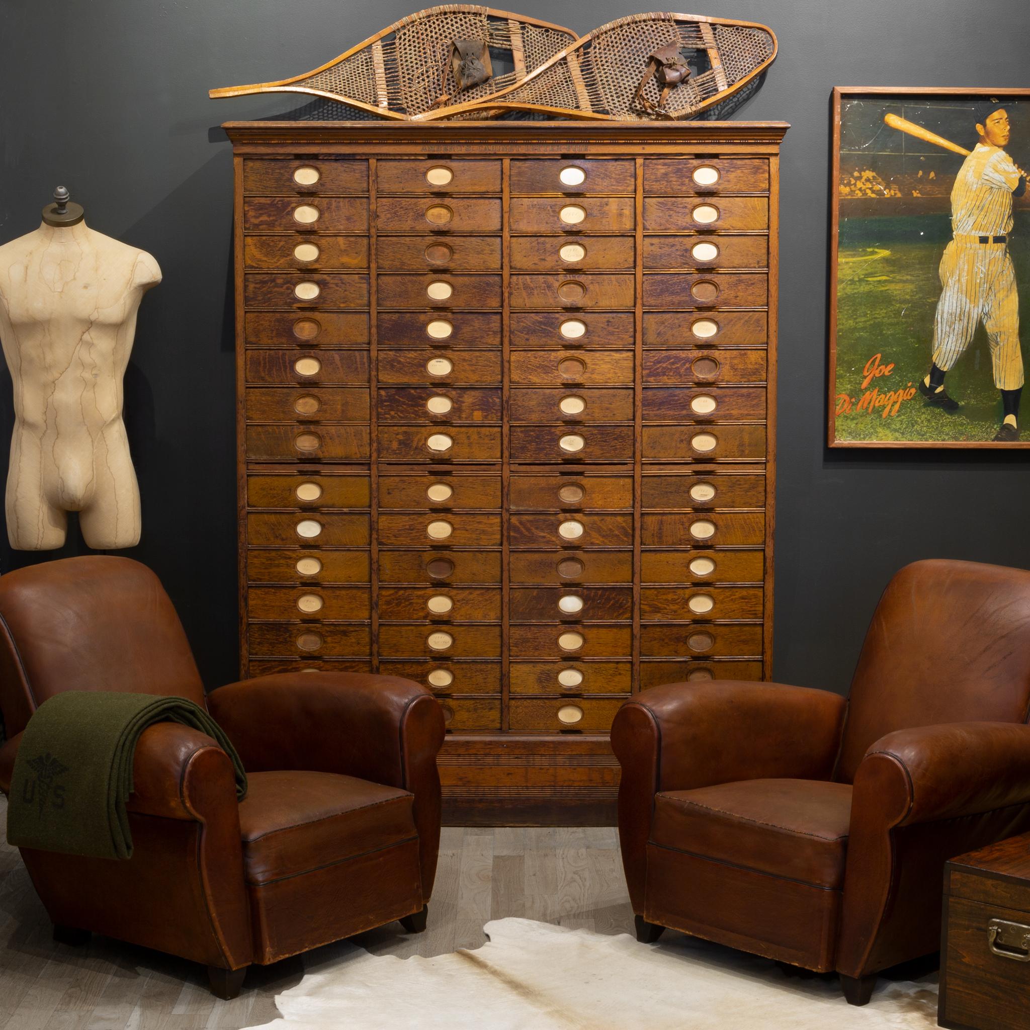 About

A monumental 60-drawer antique letter file cabinet with original stenciled name and four slide out shelves. Each drawer has an oval name tag slip, dividers and yearly documentation of letters removed.

 Creator: Amberg's File & Index Co.,