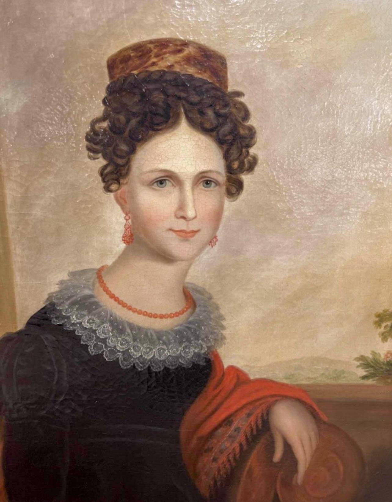 I love this! This is an American ancestral portrait of a young woman in a giltwood frame. It is an oil on canvas that dates to approximately 1840. I have not found a signature. Wonderful details include a winsome expression and a veiled hat!