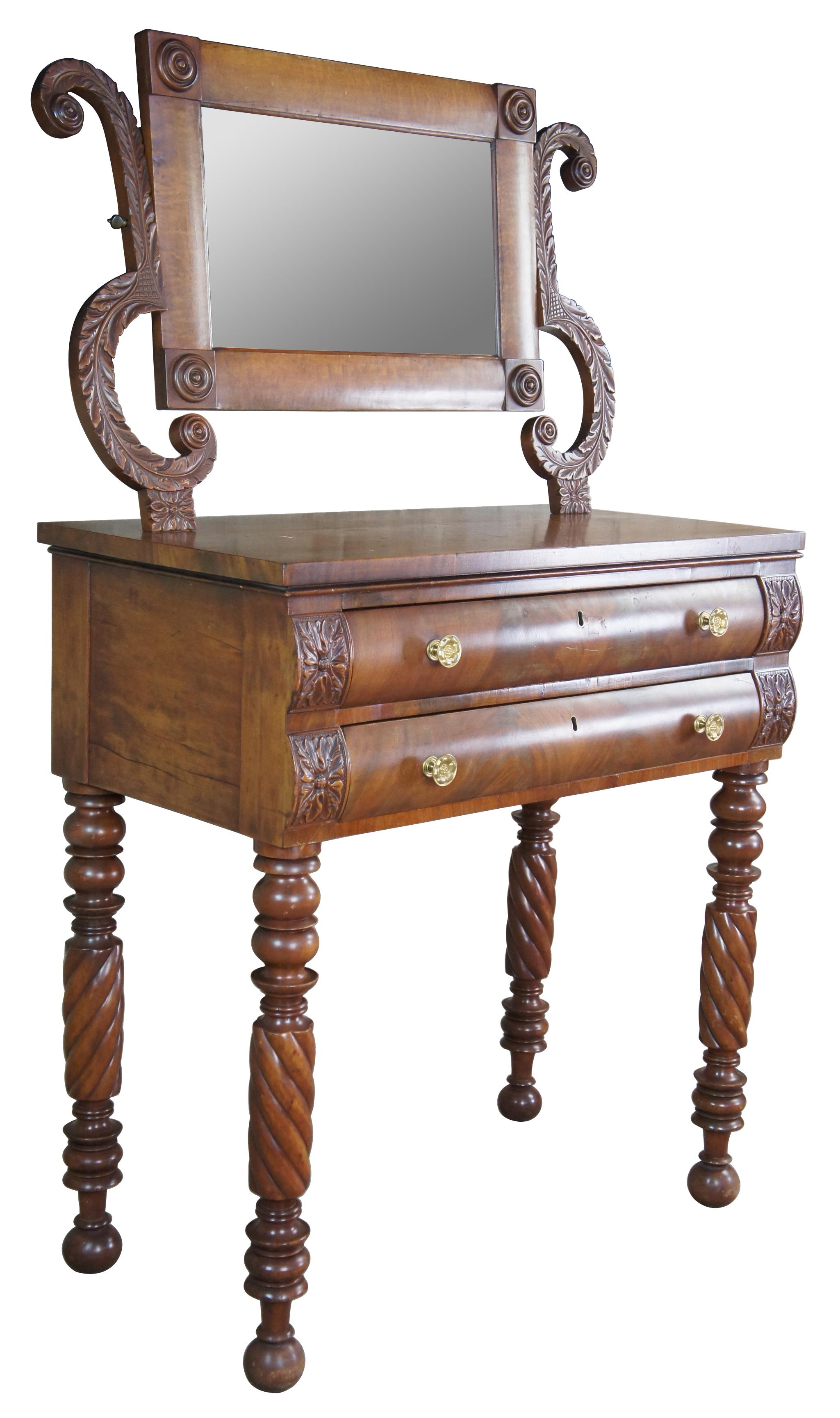 Museum quality exquisite antique early 19th century American Empire Period flame mahogany two drawer shaving stand with acanthus carved harped shaped supports, original brass knobs, adjustable mirror, and turned barley twisted legs terminating to