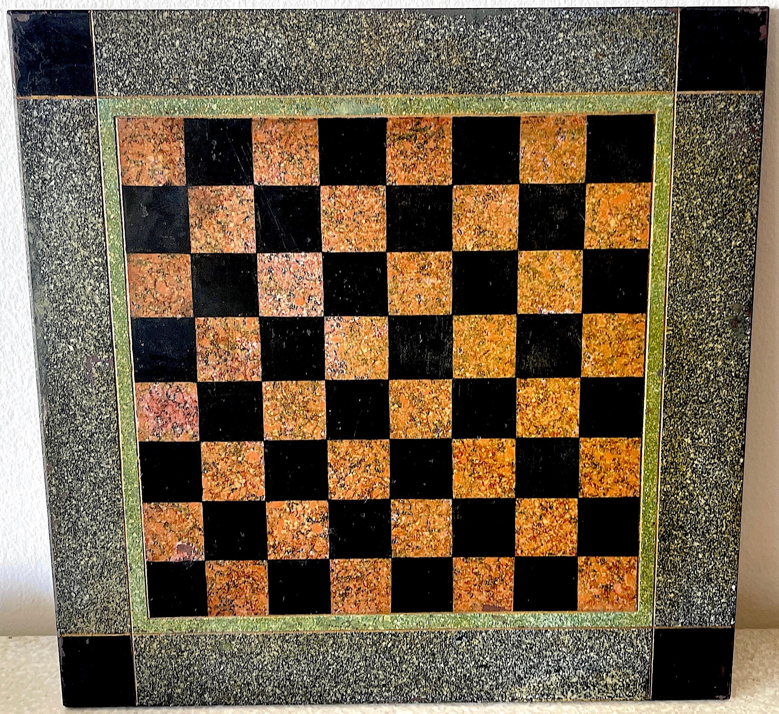 19th C American marbleized slate chess board, resembling fine marble inlay., in the neoclassical style. 
With a two inch geometric border, and a ten inch square game board. Complete with a custom wire hanger.
  