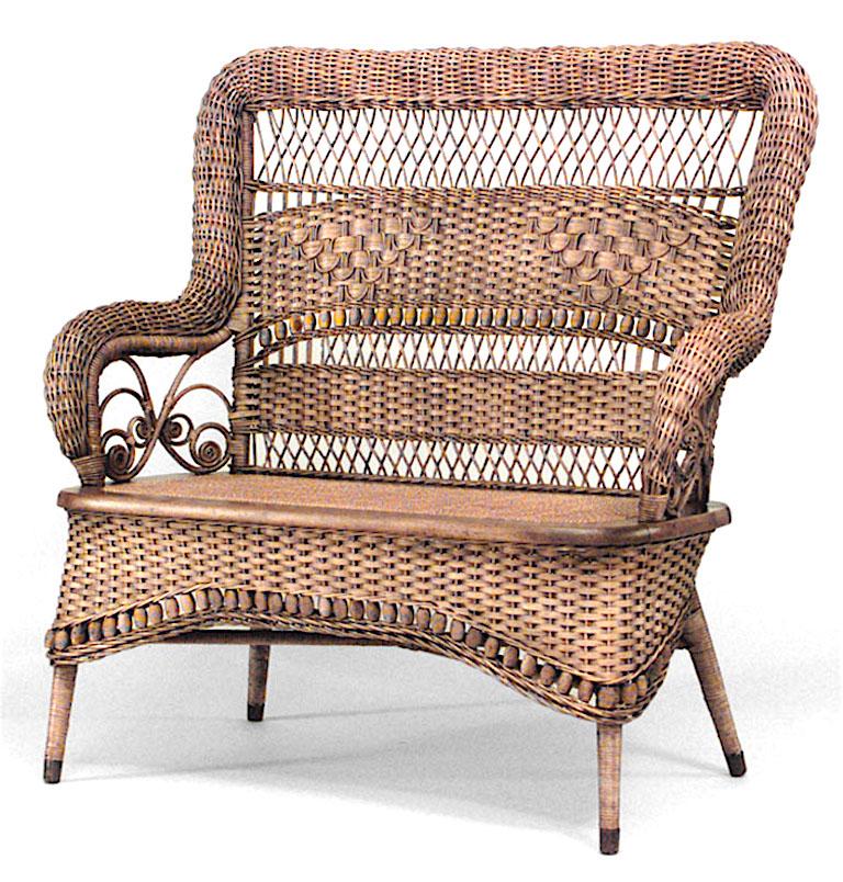 American Victorian natural wicker woven roll design high back loveseat with spindles and bobbins on back and apron. (LARKIN & CO. label)

