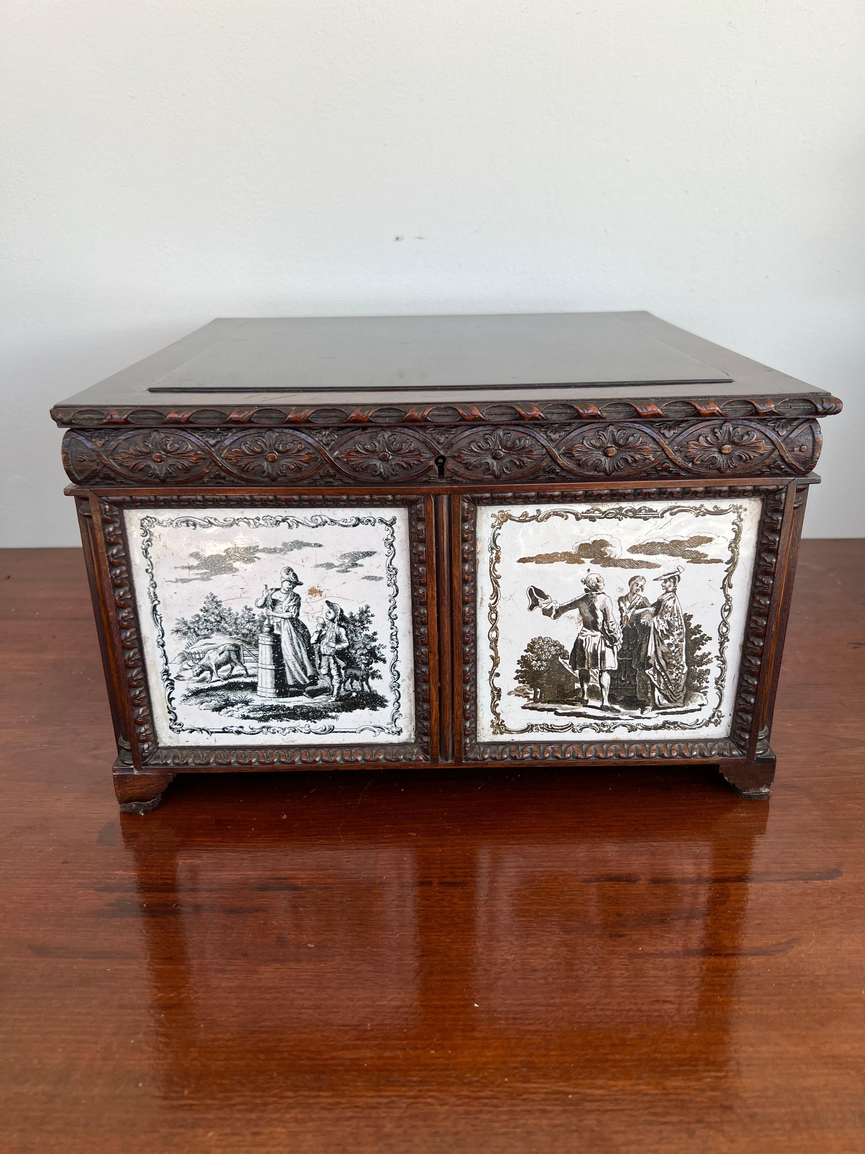 Anglo Indian, early 19th century.

A highly unusual Antique hand carved 4-section tea caddy. The box which features a carved ribbon edge hinged lid, which opens to reveal four individually wood lined tea boxes with brass finial handles. The body is