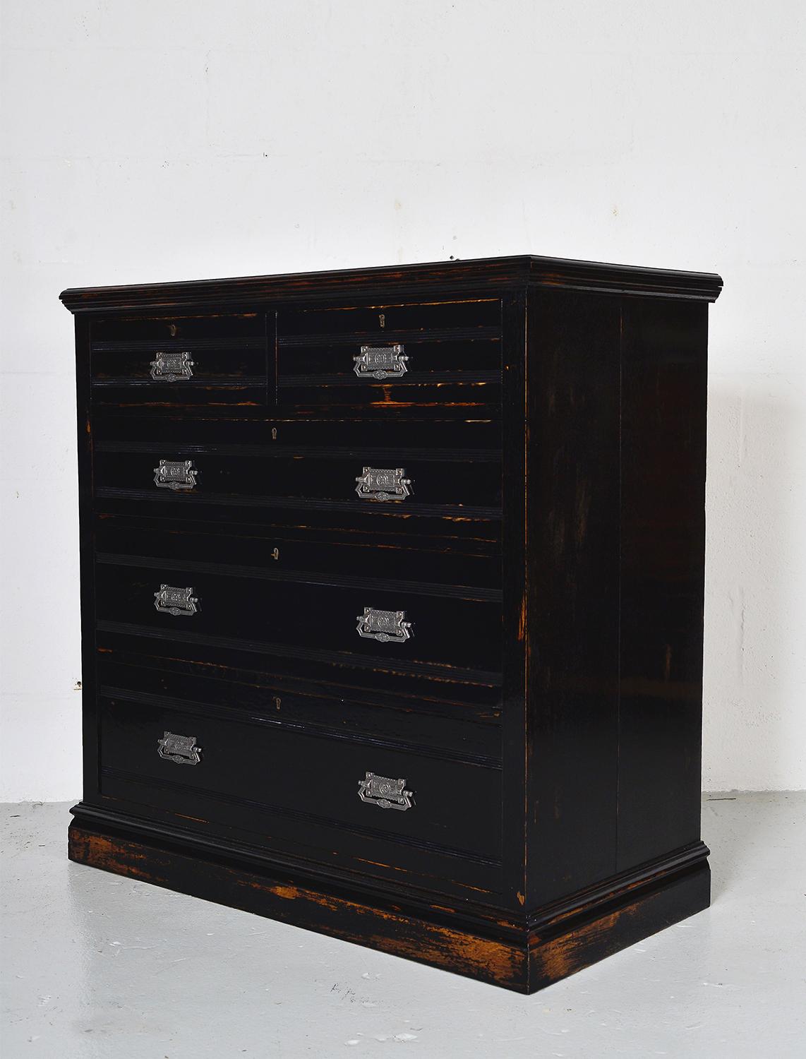 Late 19th century chest of drawers in the Eastlake style, ebonized in the Aesthetic taste. In its worn Piano black French polish finish, the rich tones of the quarter sawn oak peek through. Two over three drawers each with a wonderful reeded detail
