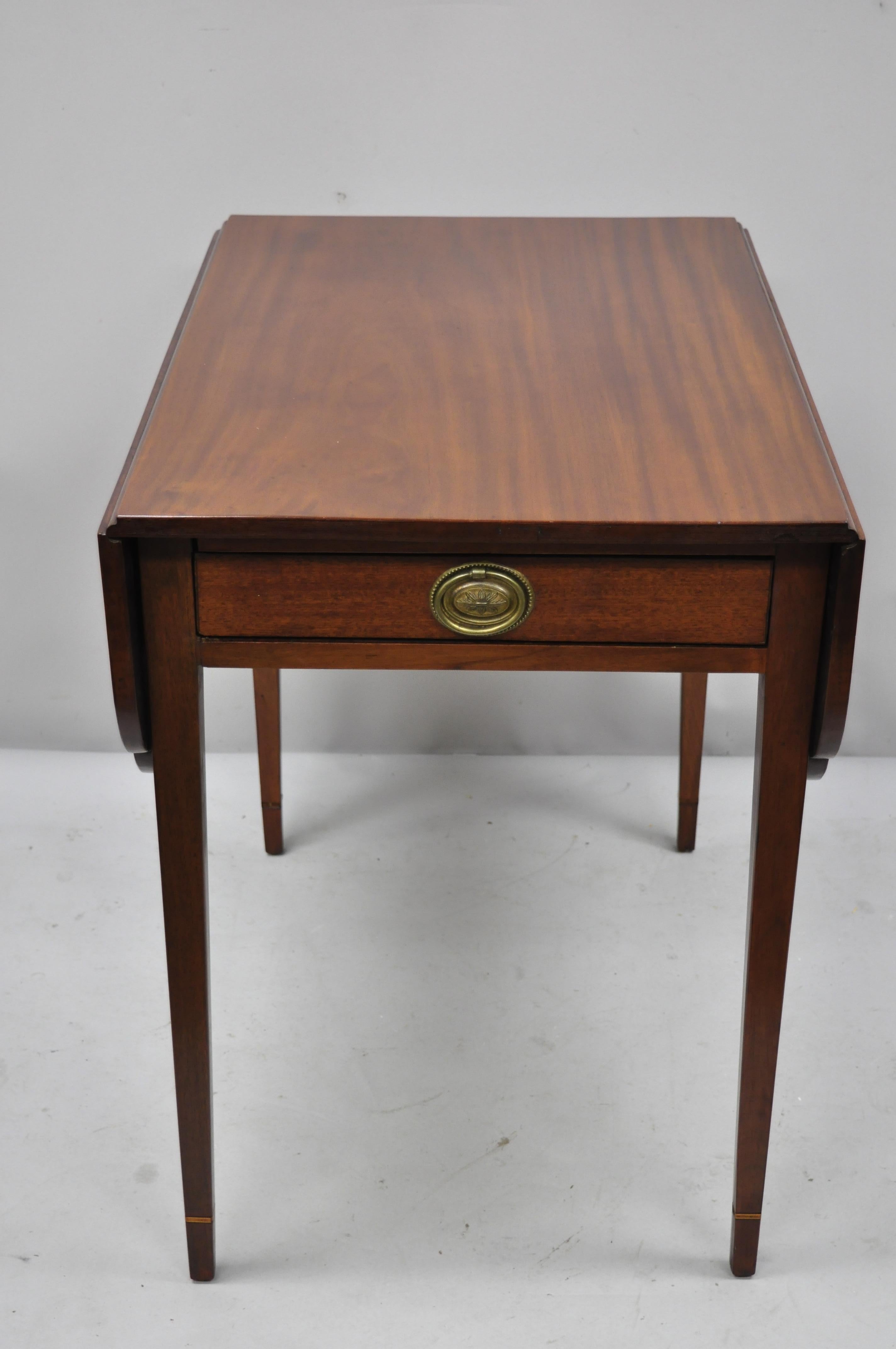 19th century antique mahogany Pembroke drop-leaf lamp side table with one drawer. Item features solid wood construction, beautiful wood grain, 1 dovetailed drawer, tapered legs, solid brass hardware, nice inlay, very nice antique item, quality