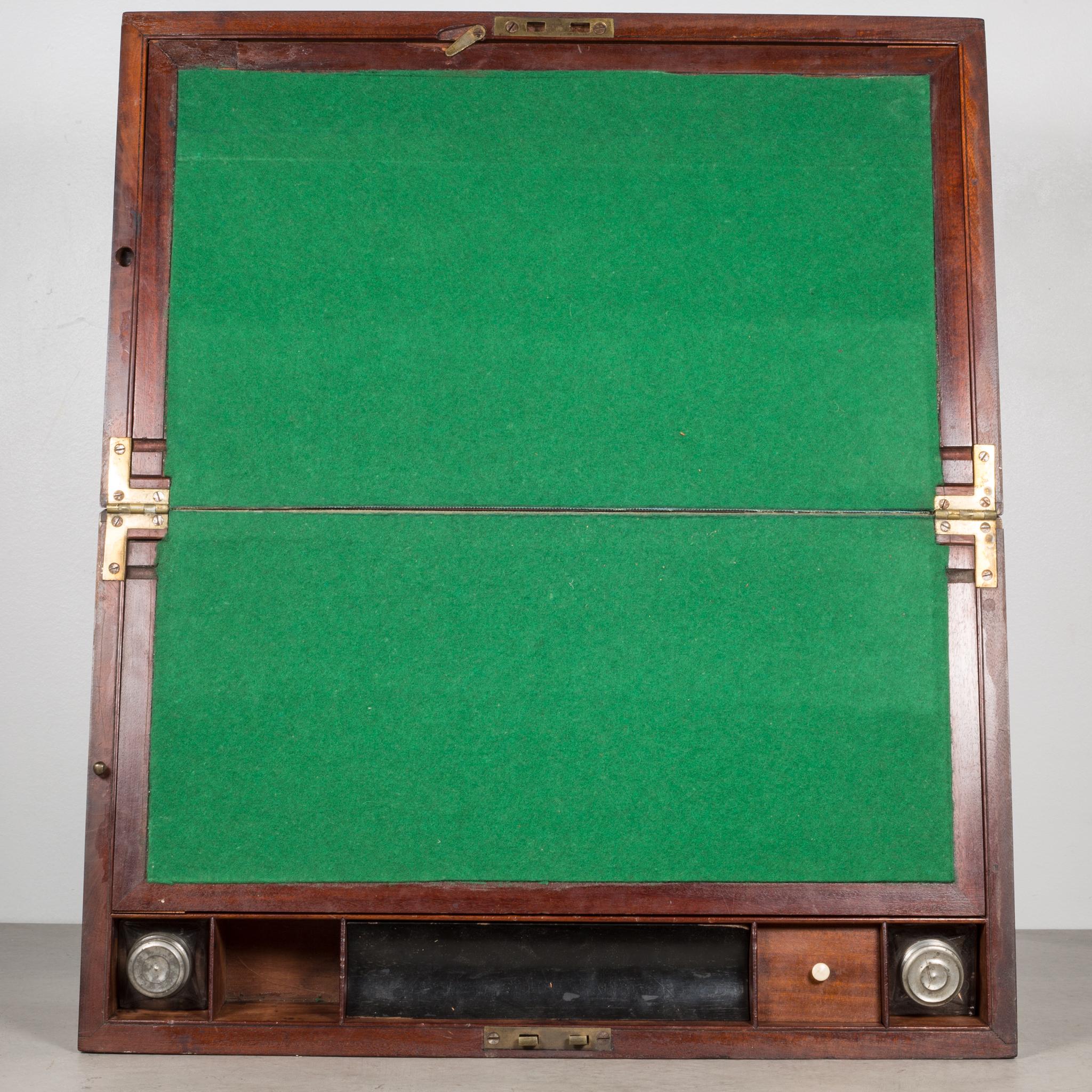 About

An antique mahogany writing slope desk with brass carrying handles, corners and key hole. The box flips open to reveal a green felt writing space and a pair original glass ink well and glass sand shaker. The pen well is fitted with a bone