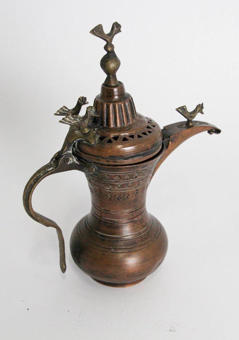 19th Century Antique Middle Eastern Asian traditional Turkish ottoman copper Dallah coffee pot.
Antique Coffee pot hand-hammered and chased copper with riveted brass finish and a very large spout.
Small birds figure on top of the spout, cover and