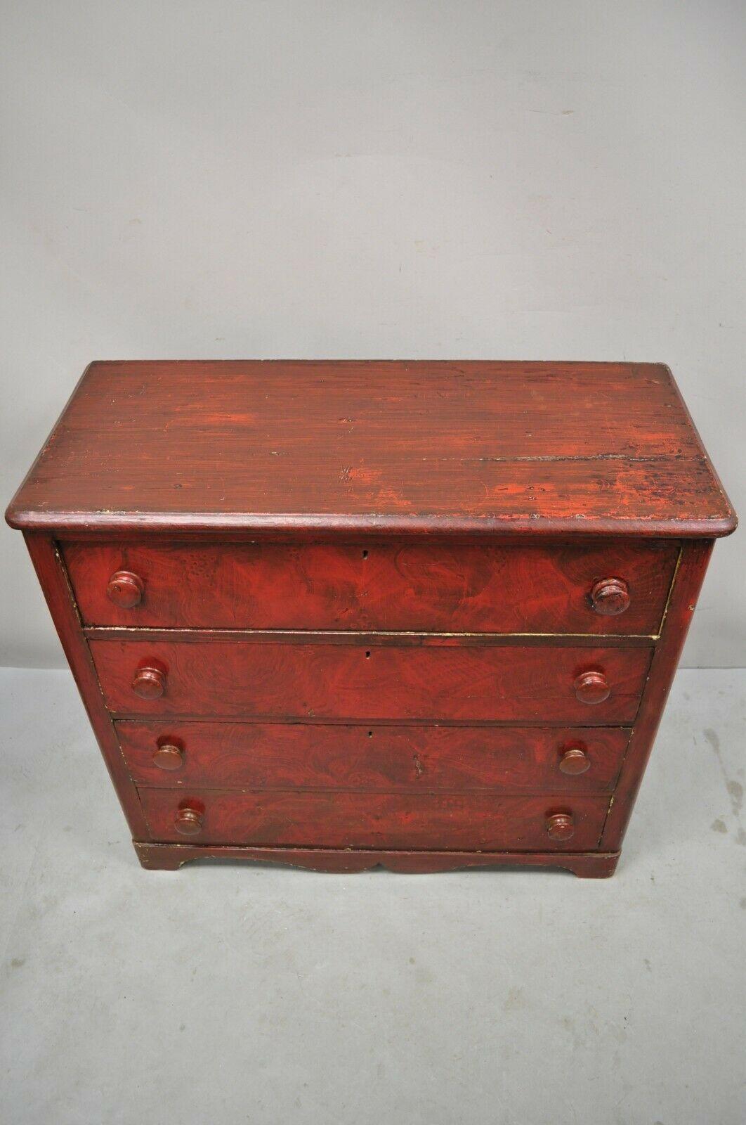 19th C Antique primitive red grain painted 4 drawer chest of drawers dresser. 
 Item features red faux grain painted finish, round wooden drawer pulls, panel back, 4 dovetailed drawers, very nice antique item. Circa 19th century. Measurements: 35