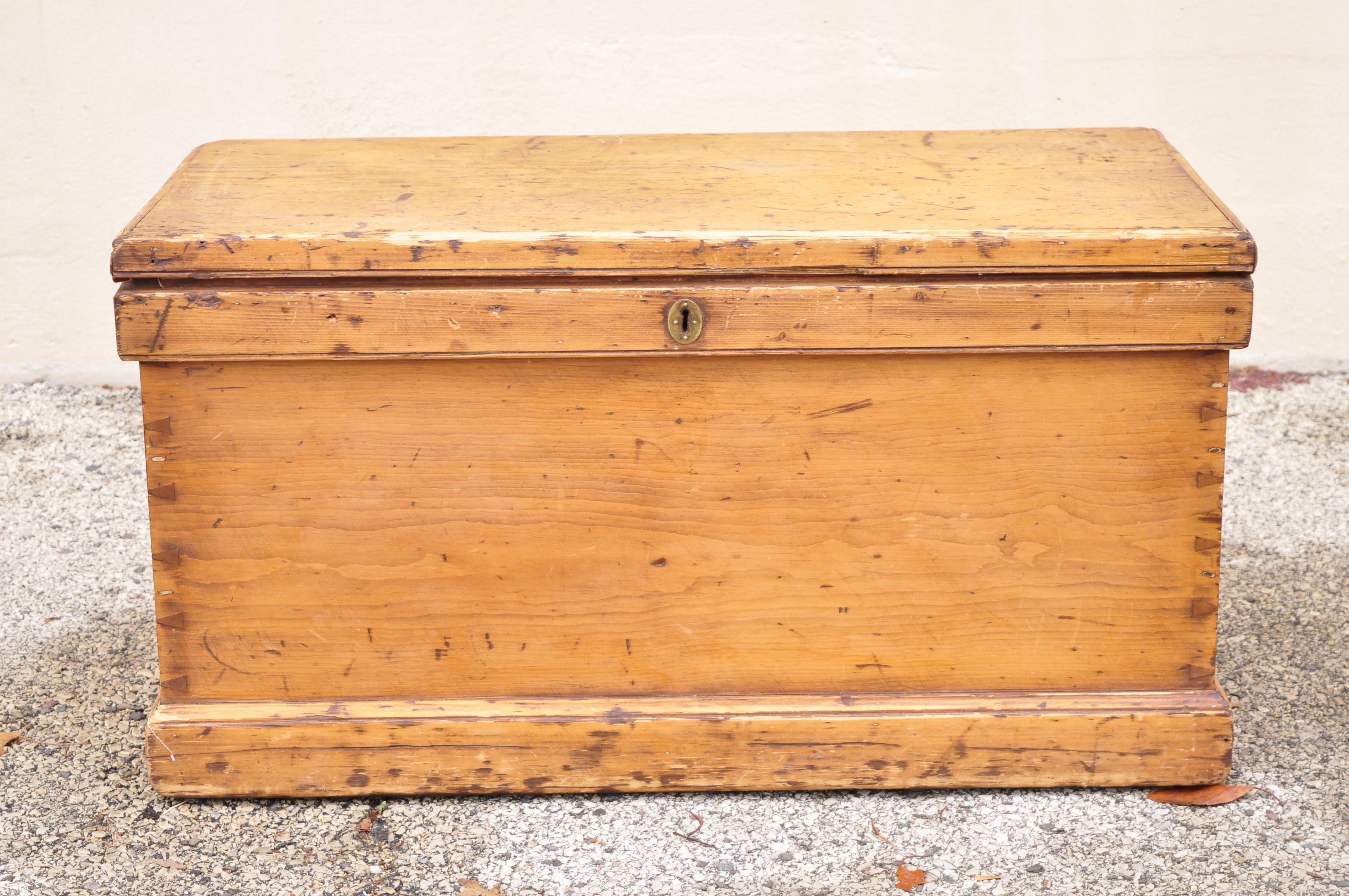 19th Century antique rustic chestnut wood wooden dovetail blanket chest trunk. Item features cast iron hardware, dovetail construction, small drawers and flip storage to inside, solid wood construction, distressed finish, very nice antique item,