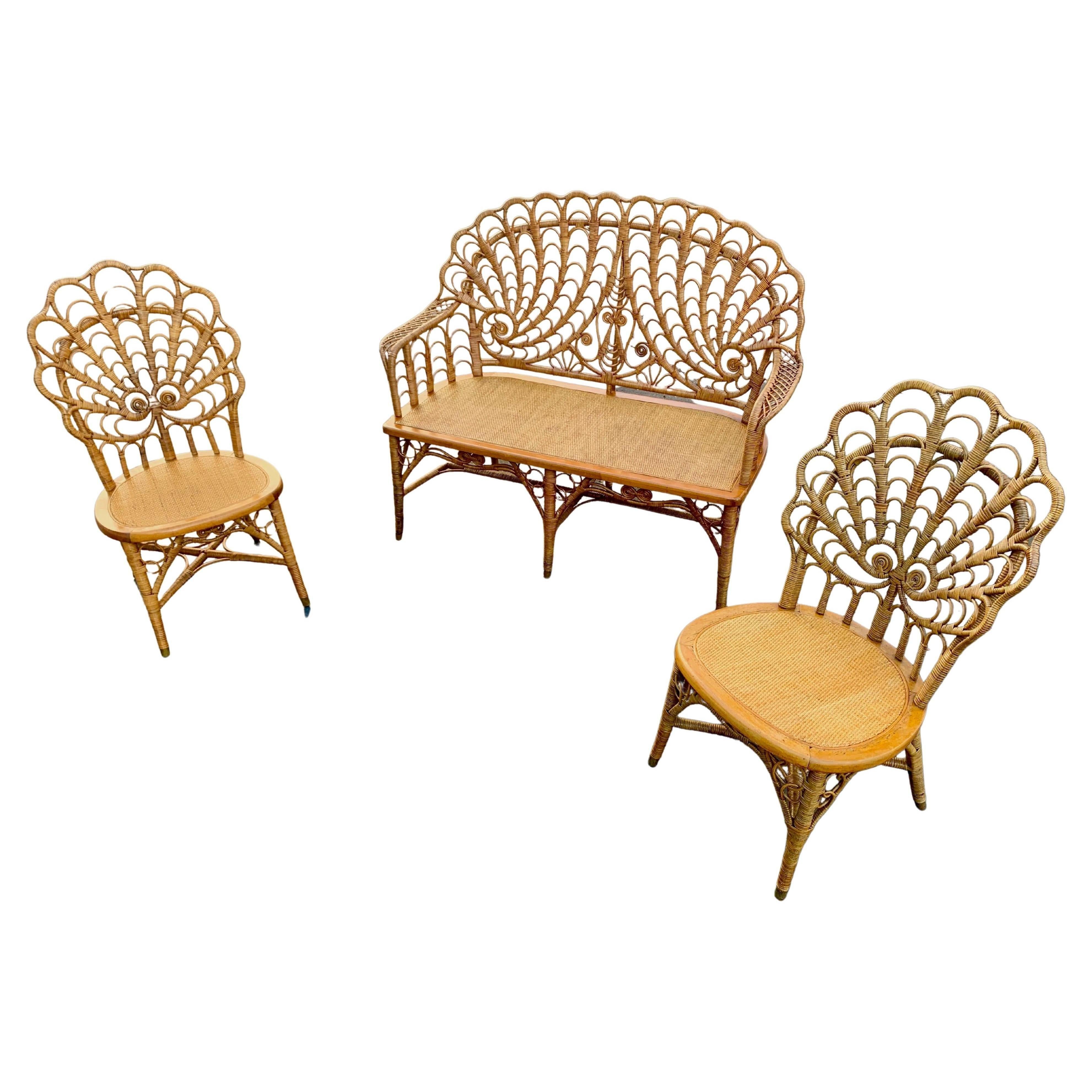 A rare suite of antique Heywood Brothers wicker furniture, American,C. 1890s,Gardner, Massachusetts.This antique suite is in a beautiful natural finish. It is woven in what is often called a shell back design because of it's chair backs having a