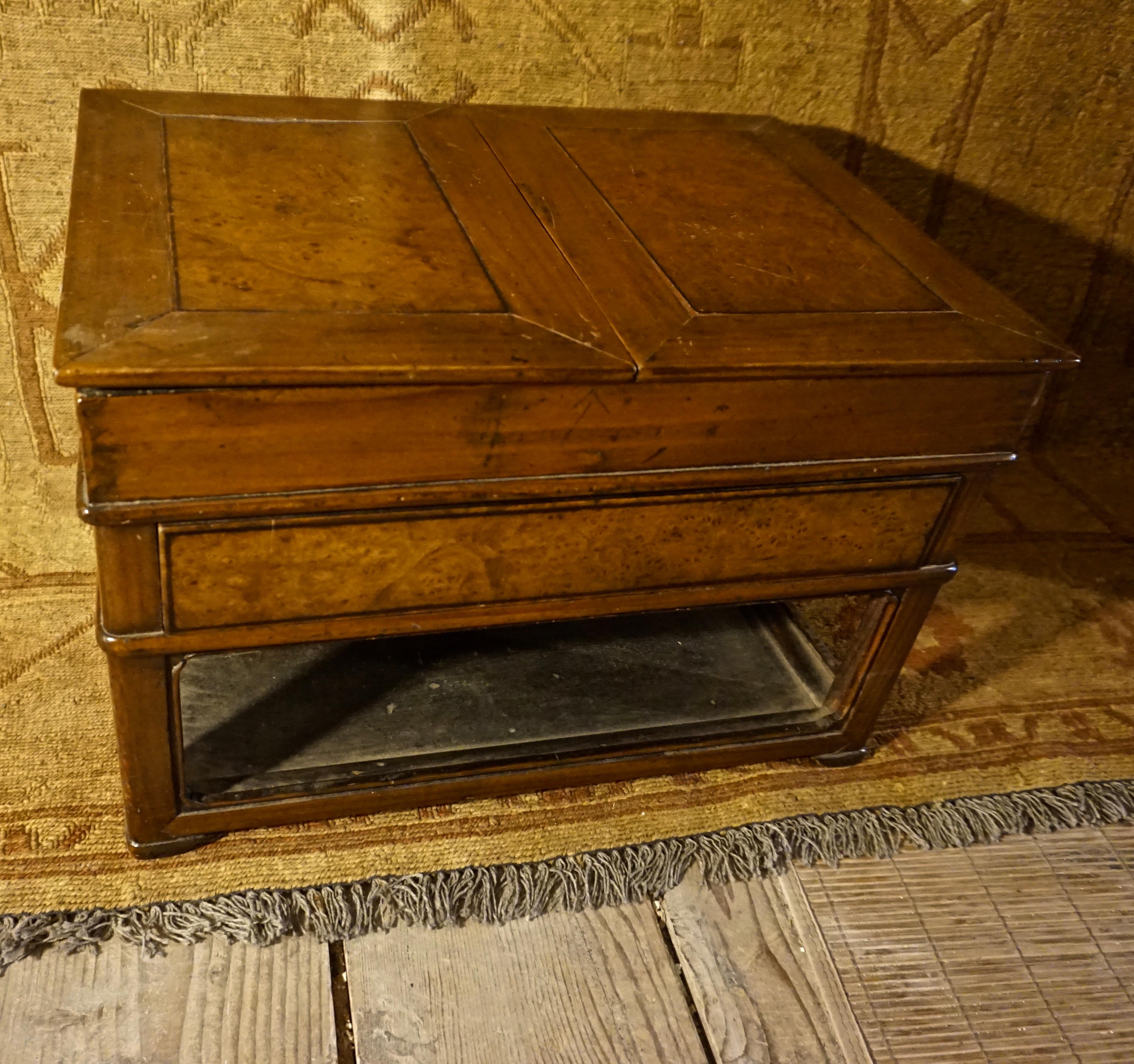 Uniquely conceived Asian scholar's writing table with flaps and drawers as well as open tier for housing paperwork, stationary etc. Simple lines with old patina. Some ink stains present within drawers,

circa 1890s.