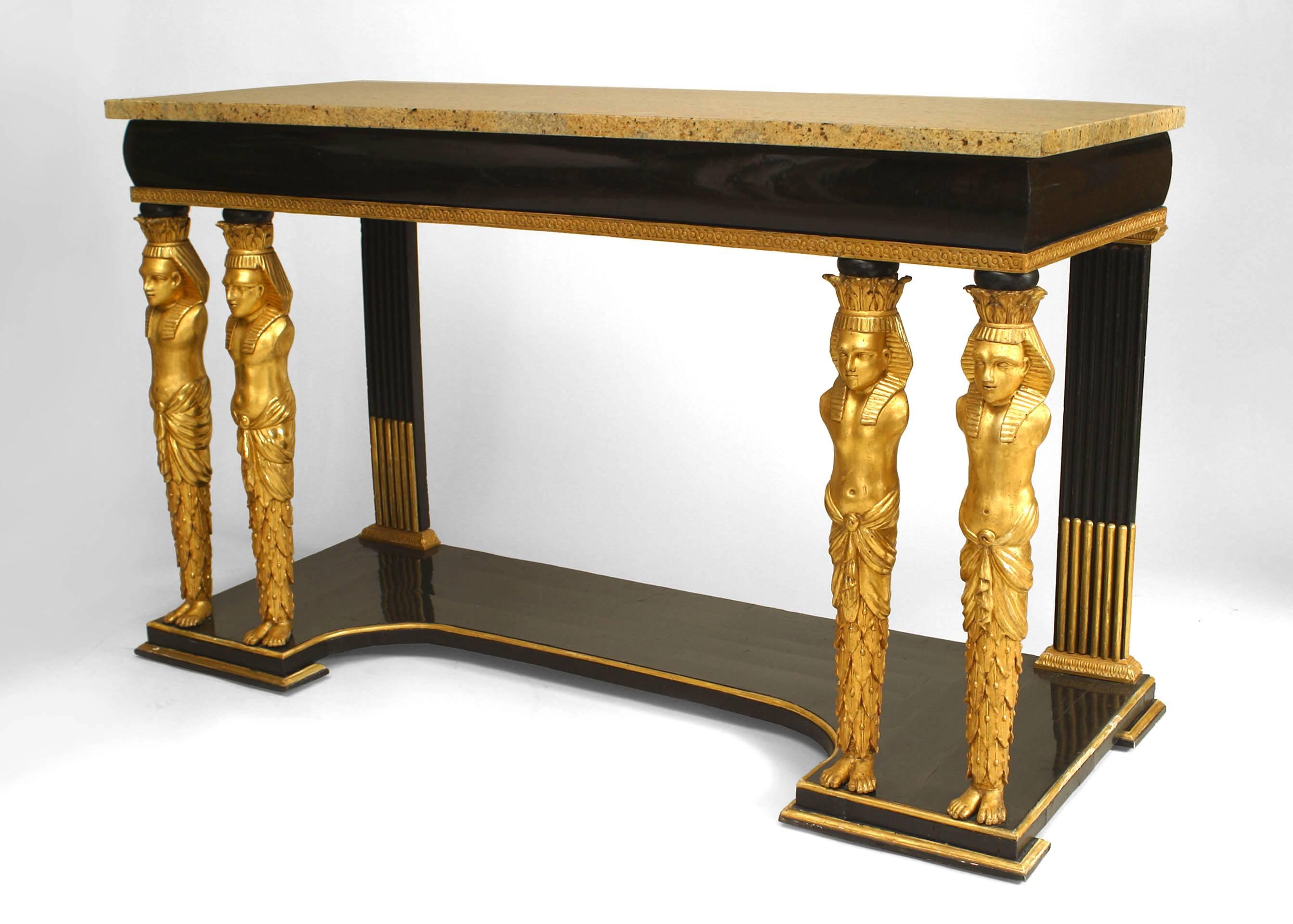 Early 19th century Austrian ebonized and gilt trimmed console table distinguished by four gilt carved classical Egyptian figural pillars, each resting upon a platform base and supporting a marble top.