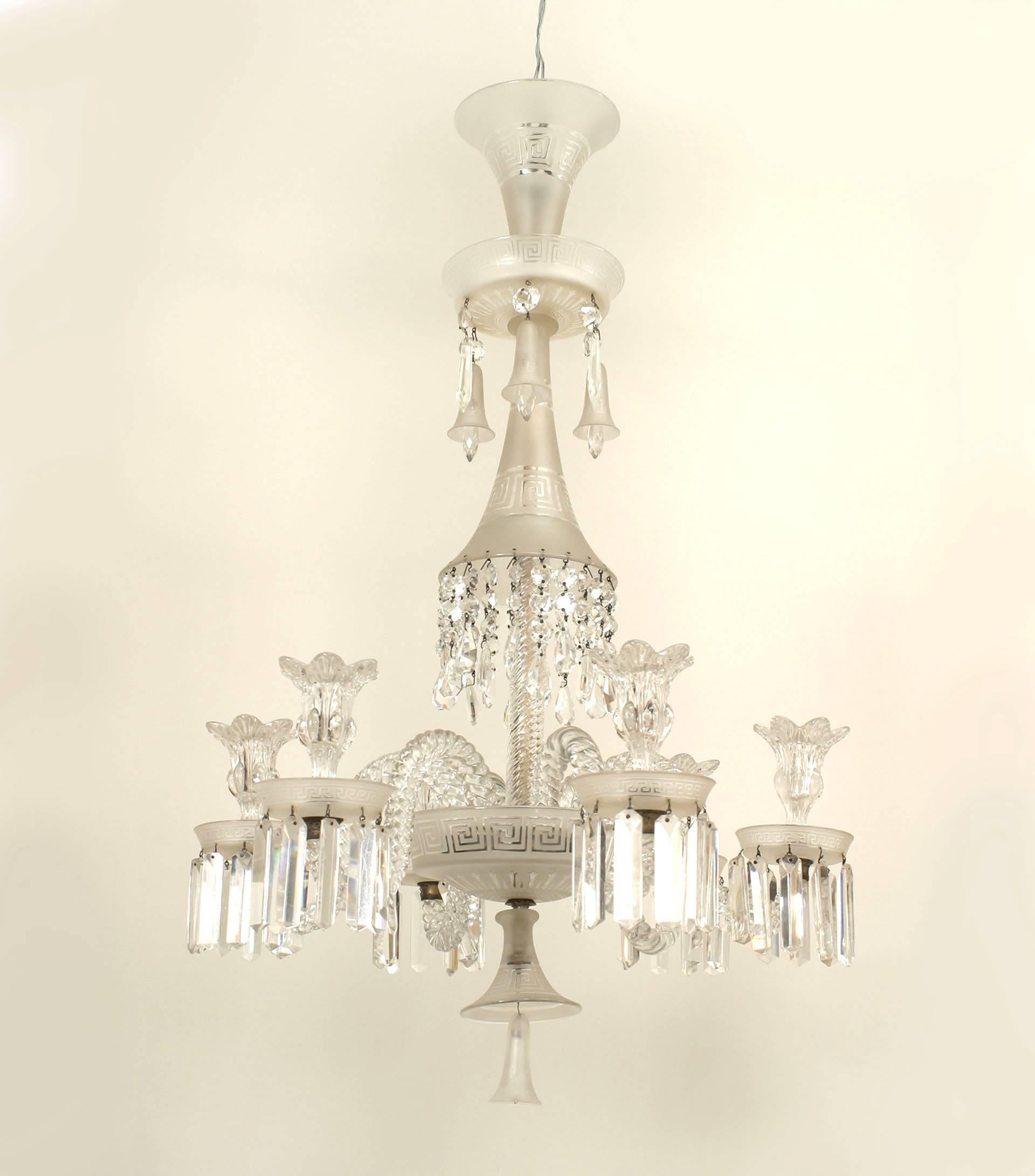 French (19th Century) frosted & clear Baccarat crystal chandelier with two-tiered ten upswept swirl arms having etched Greek key motif bobeche & crystal drops and a finial ball bottom.
