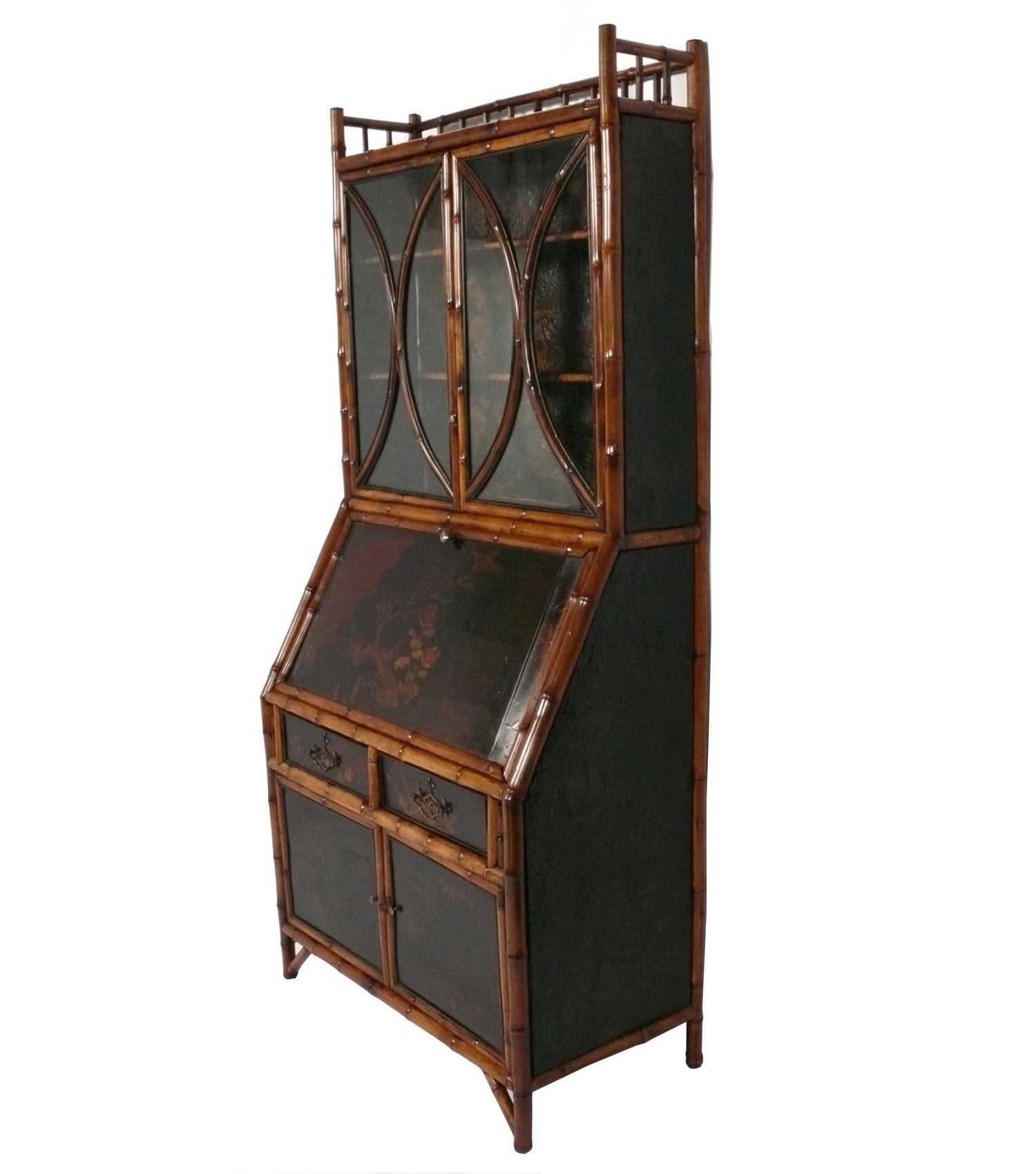 Elegant 19th Century Bamboo Chinoiserie Secretary or Cabinet, England, circa late 19th century. This piece is a versatile size and could be used as a secretary, bookshelf, or bar cabinet in a living area,
or as a chest, dresser, or desk in a