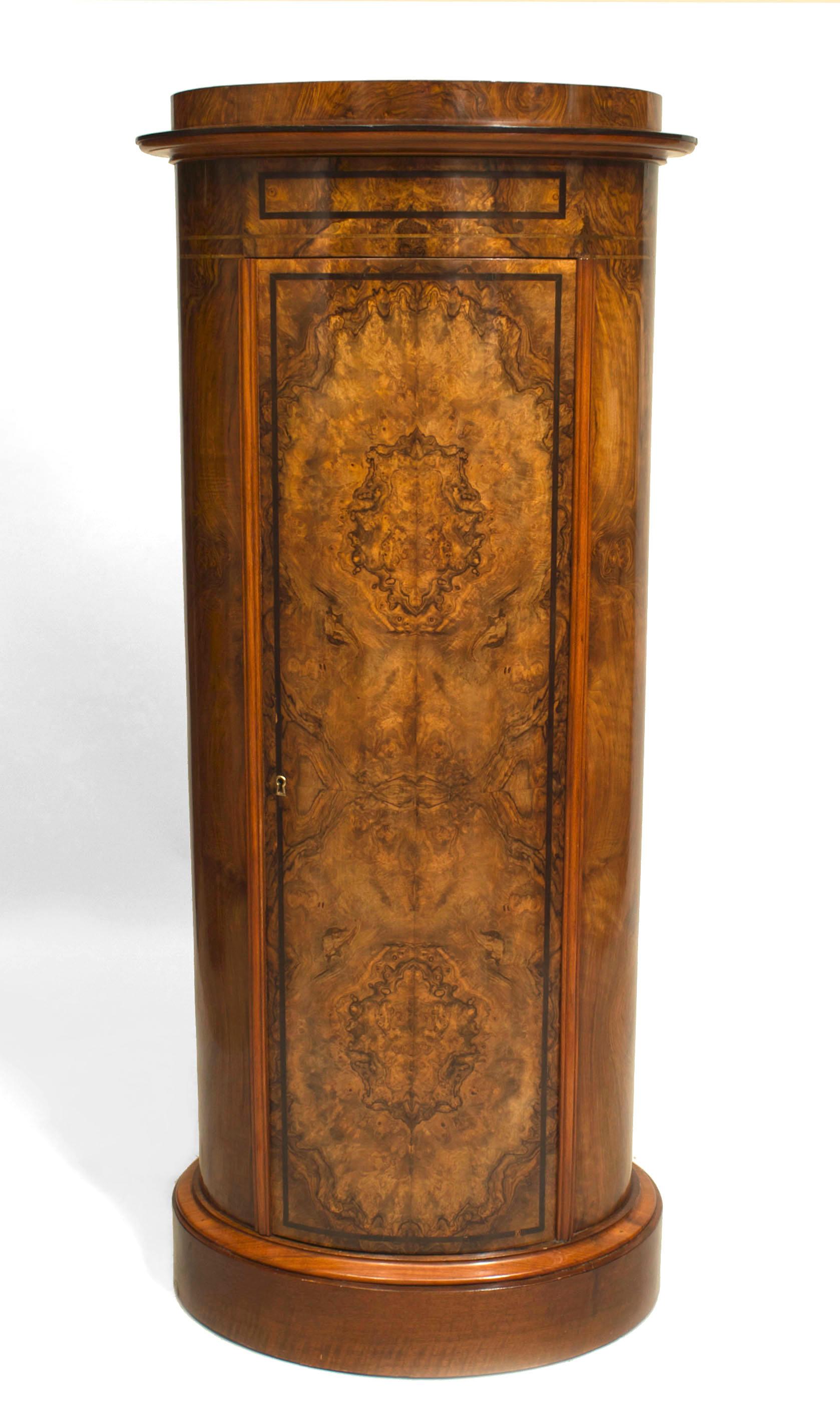 Biedermeier Austrian/German (19th Century) burl walnut tall oval shaped pedestal cabinet with a large single front door and ebonized banded trim.
