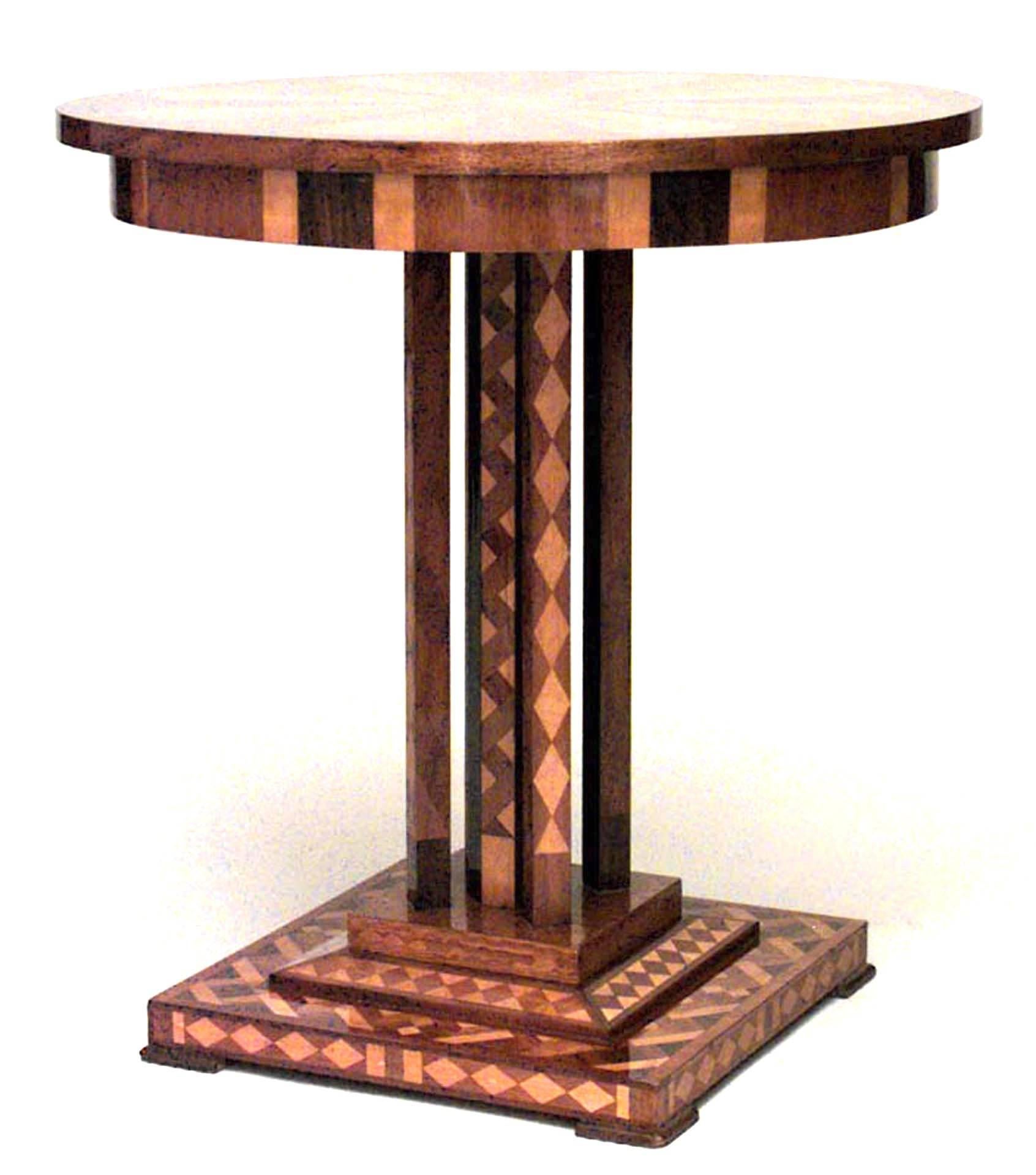 Nineteenth century Austrian Biedermeier geometric inlaid mahogany end table with a round top supported by four square columns and an octagonal post pedestal above a square base.