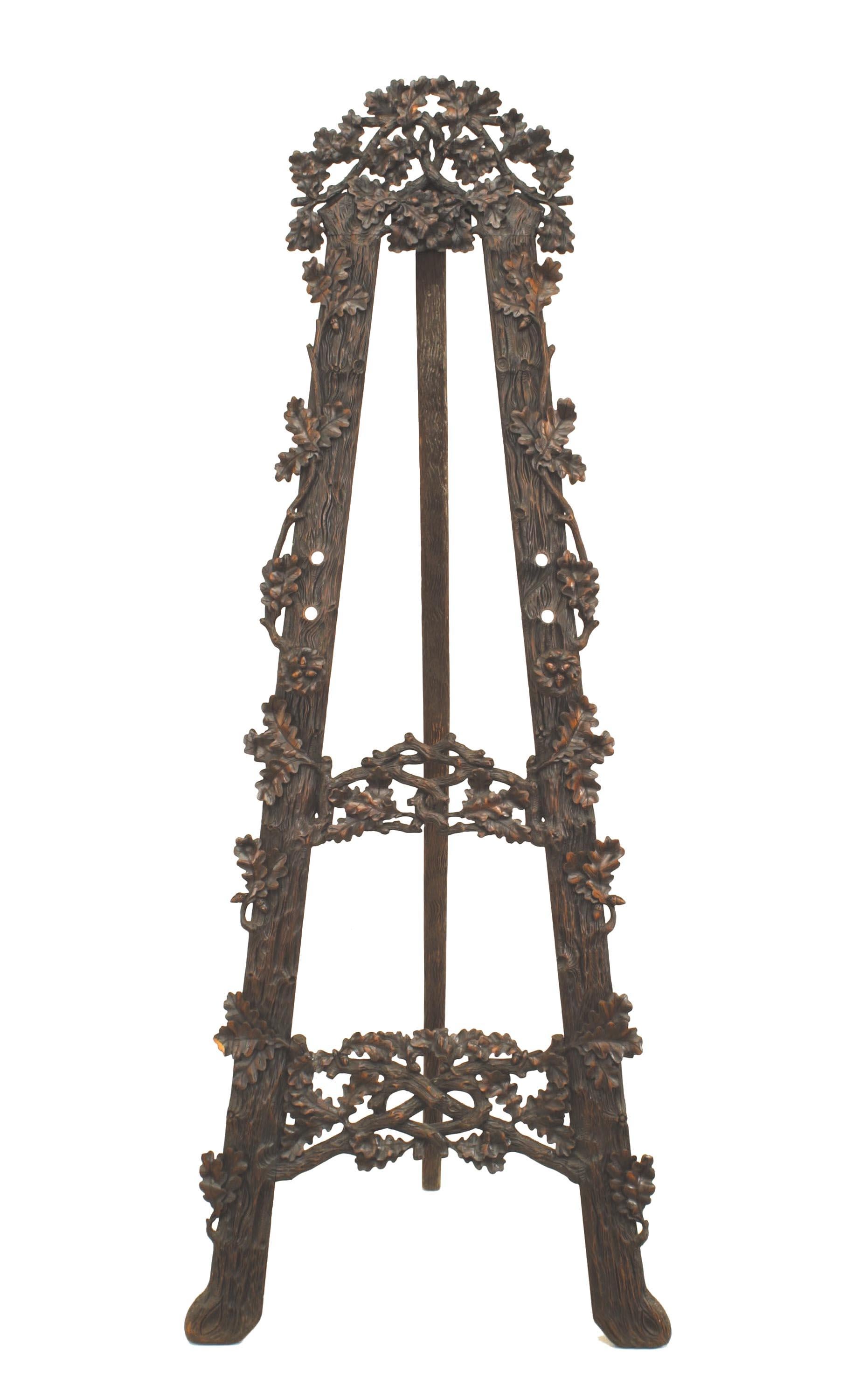 Rustic Black Forest (19th Cent) walnut floral carved easel stand.
