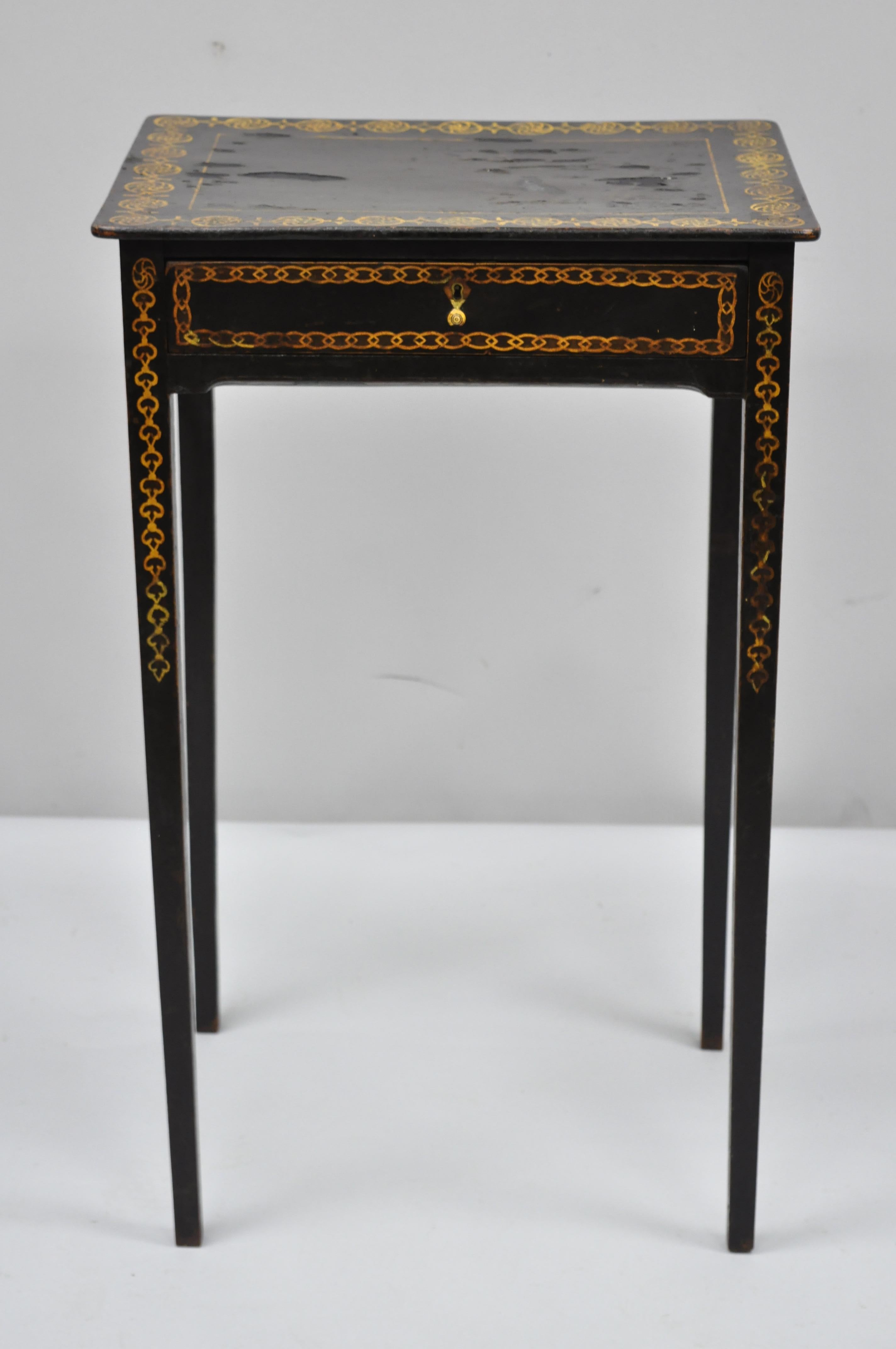 19th century black lacquer hand painted English Victorian side table. Item features paint decorated on all sides, black lacquer finish, solid wood construction, no key but unlocked, tall tapered legs, very nice antique item, circa early 19th