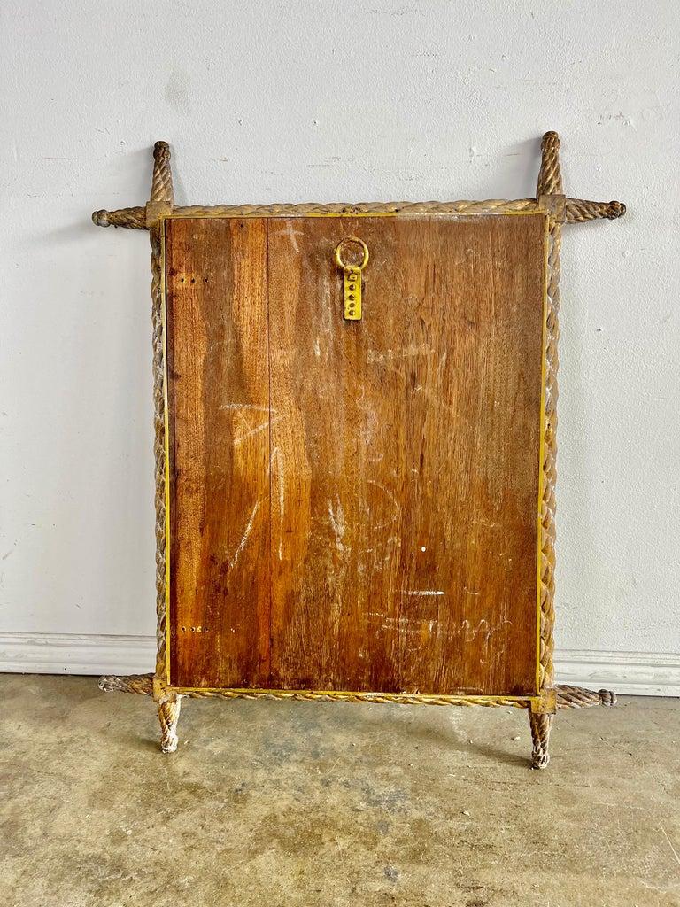 Charming 19th century hand carved giltwood mirror. The carving is unique and looks to be braided. The finish is worn with bits of gold missing. Great accent mirror in any style decor.