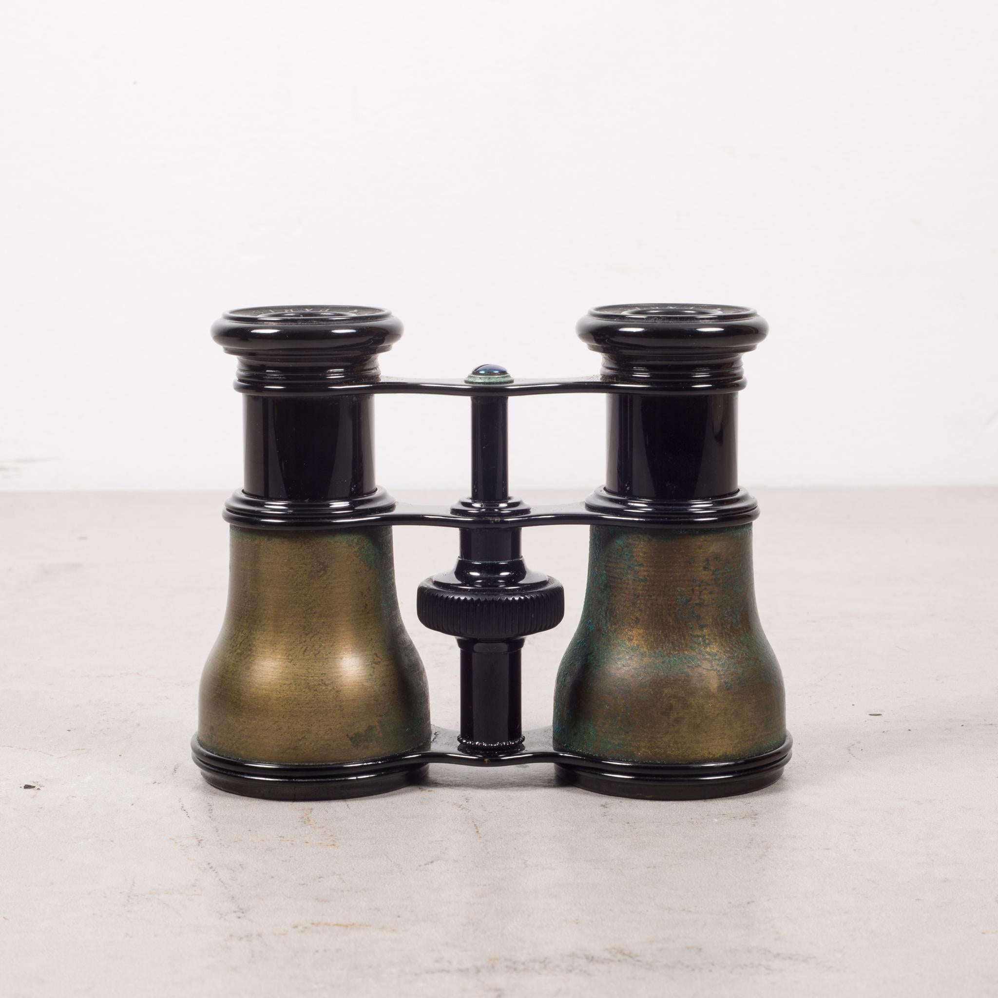About:

An antique pair of brass binoculars marked on the eyepiece with 