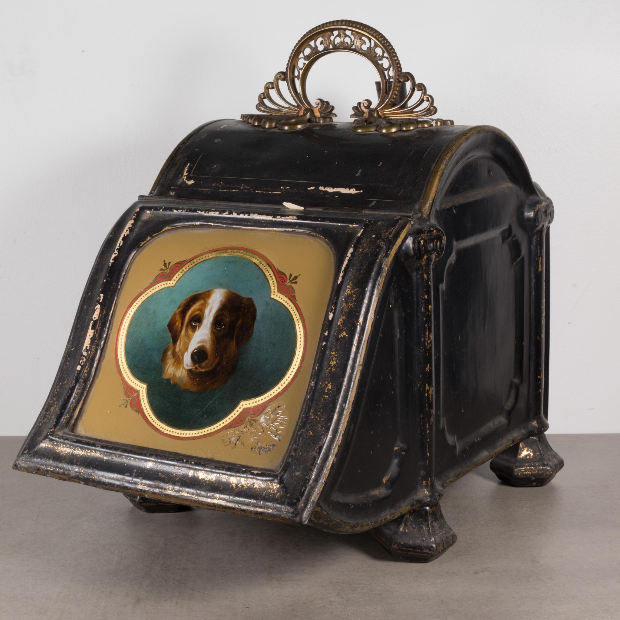 ABOUT

Mid 19th century British coal scuttle or coal hod with ornate handle, portrait of a dog, and hand scoop. Brass handle and painted brass metal body.

 CREATOR Unknown.
 DATE OF MANUFACTURE c.1860.
 MATERIALS AND TECHNIQUES Metal, Brass.