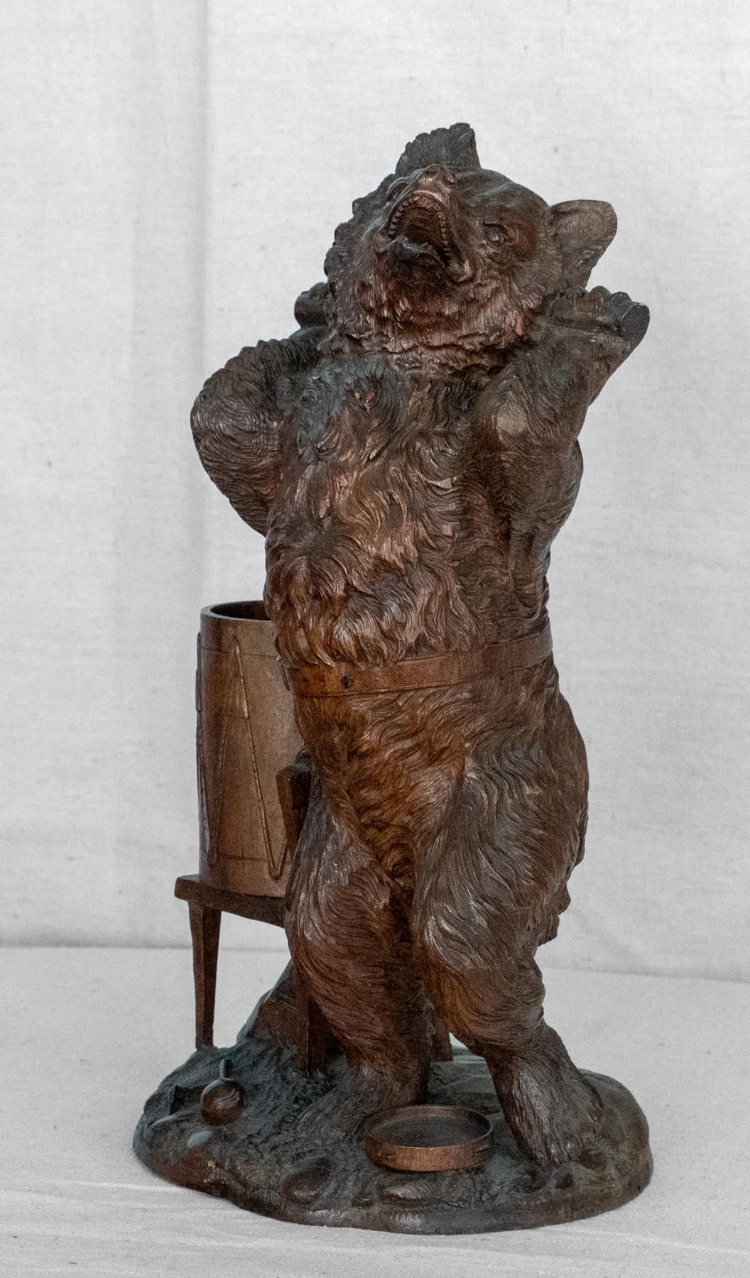 Late 19th century Continental carved walnut bear / cigar holder. In the style of Black Forest, German, Possibly Russian. The complex form of a classic dancing bear on hind legs. Standing on a base with a drum, tambourine and musical instruments. The