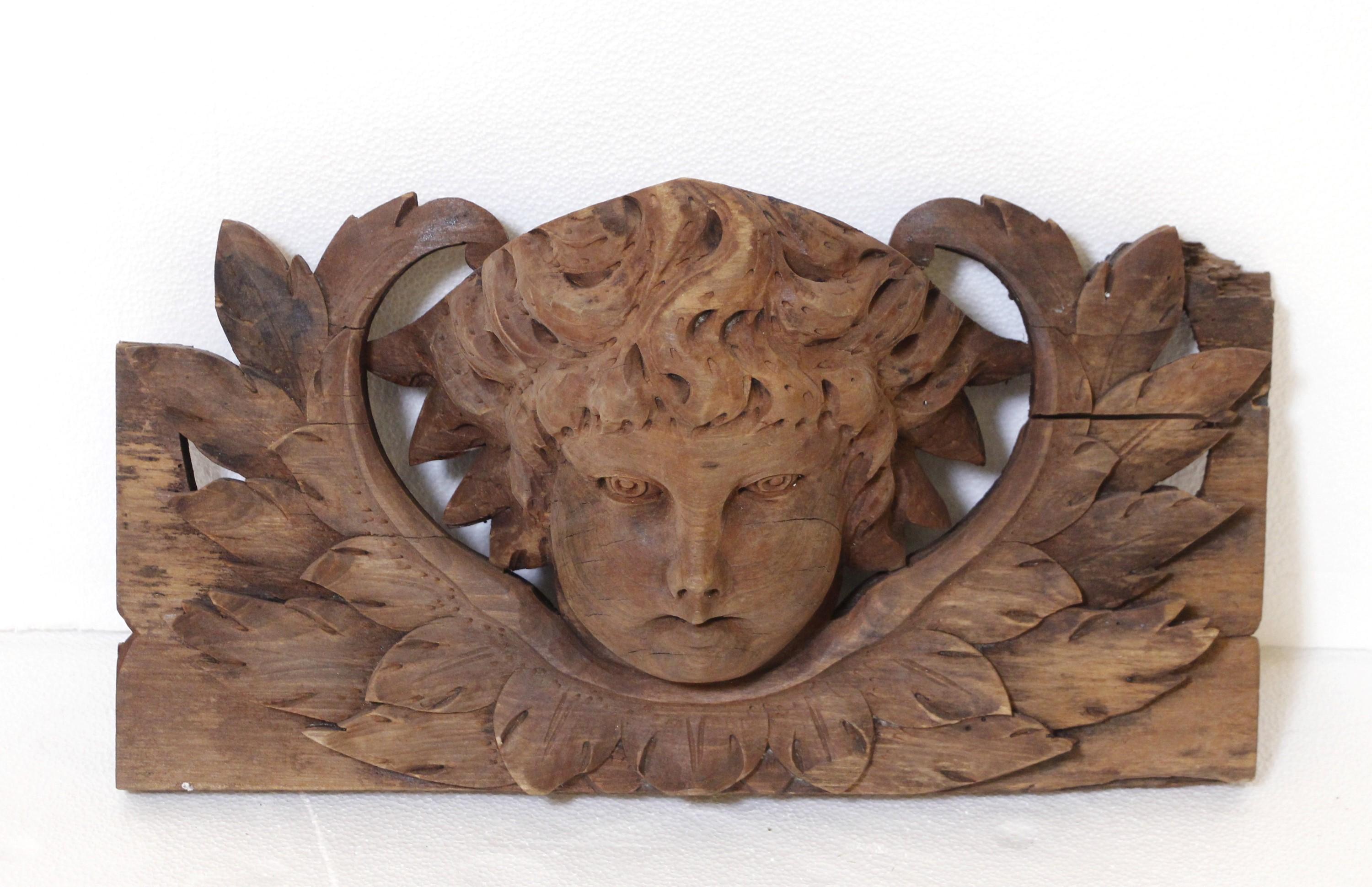 Antique hand carved angel cherub face, perhaps part of a door surround, from the early 1900s.  The craftsmanship on this piece is impeccable. There is a mounting bracket hanging on the back. Good condition with appropriate wear from age. Due to the