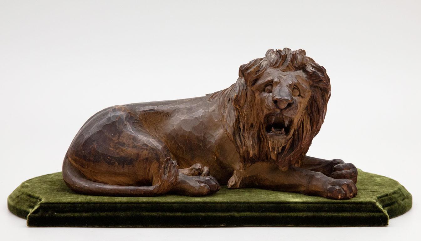 19th Century Carved Wooden Reclining Lion on a Green Velvet Base In Excellent Condition In New York, NY
