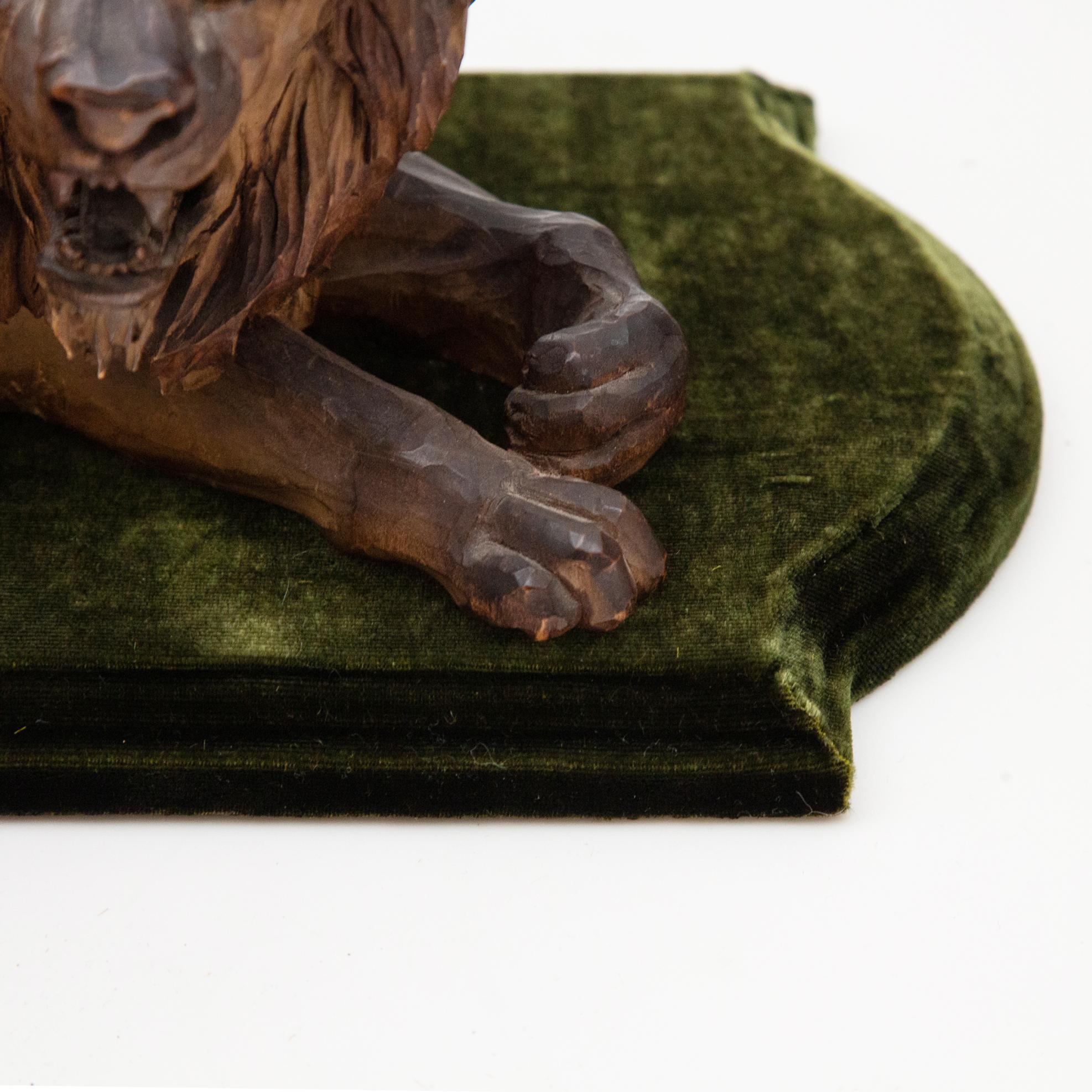 19th Century Carved Wooden Reclining Lion on a Green Velvet Base 4