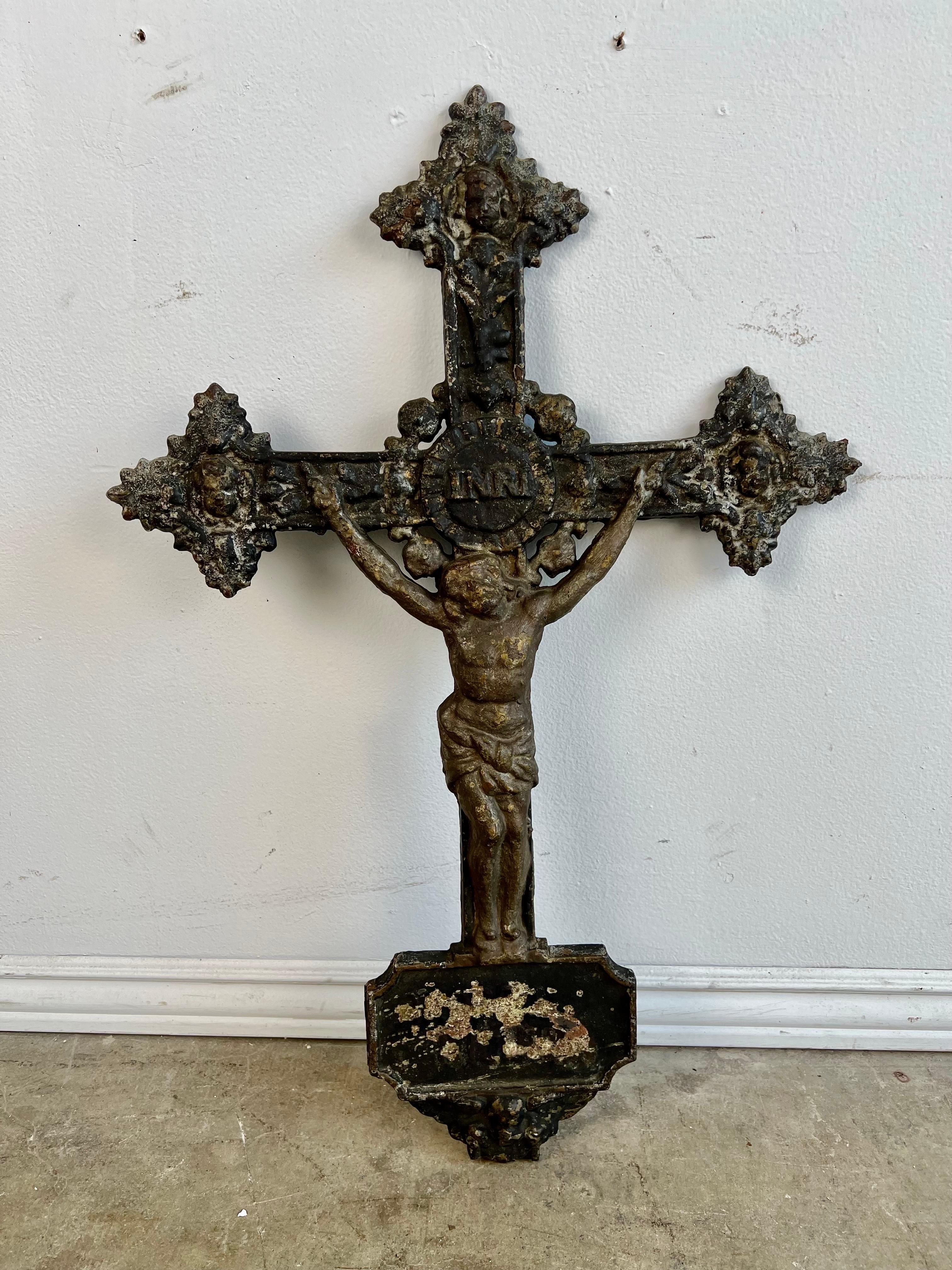 19th C. cast iron Cross with beautiful details surrounding Jesus on the Cross .  The Cross has developed a great patina over many years from exposure to the elements.