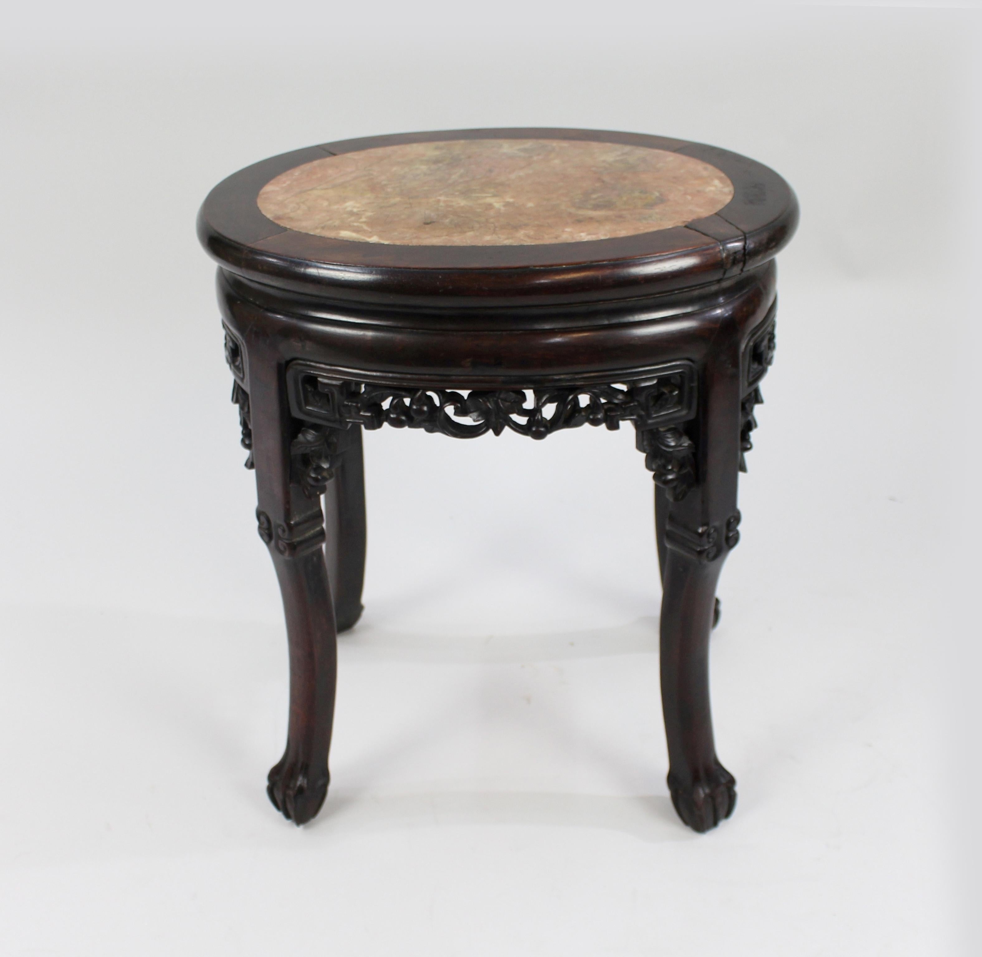 Period 19th century, Chinese
Composition rouge marble top, carved rosewood frame
Condition good condition commensurate with age. Original marble top. Split to wood on top of table as pictured. Section of carving to top of one leg missing as
