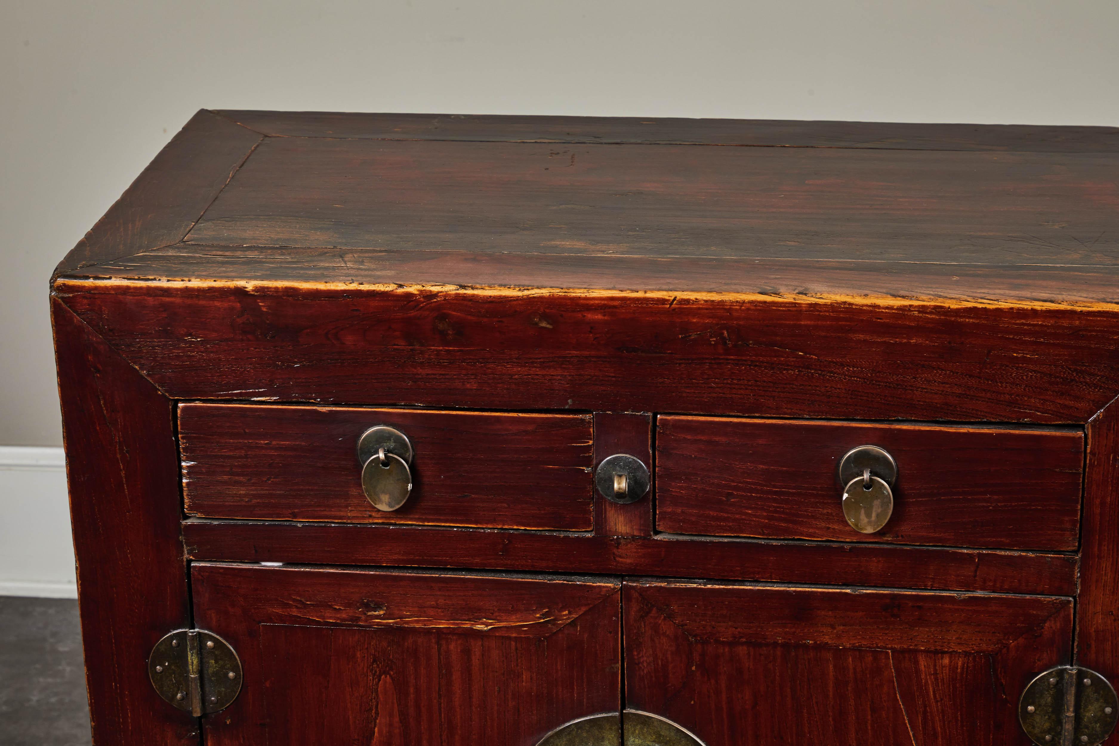 Four-door, four-drawer elm cabinet with original finish from Hebei, circa 19th century.