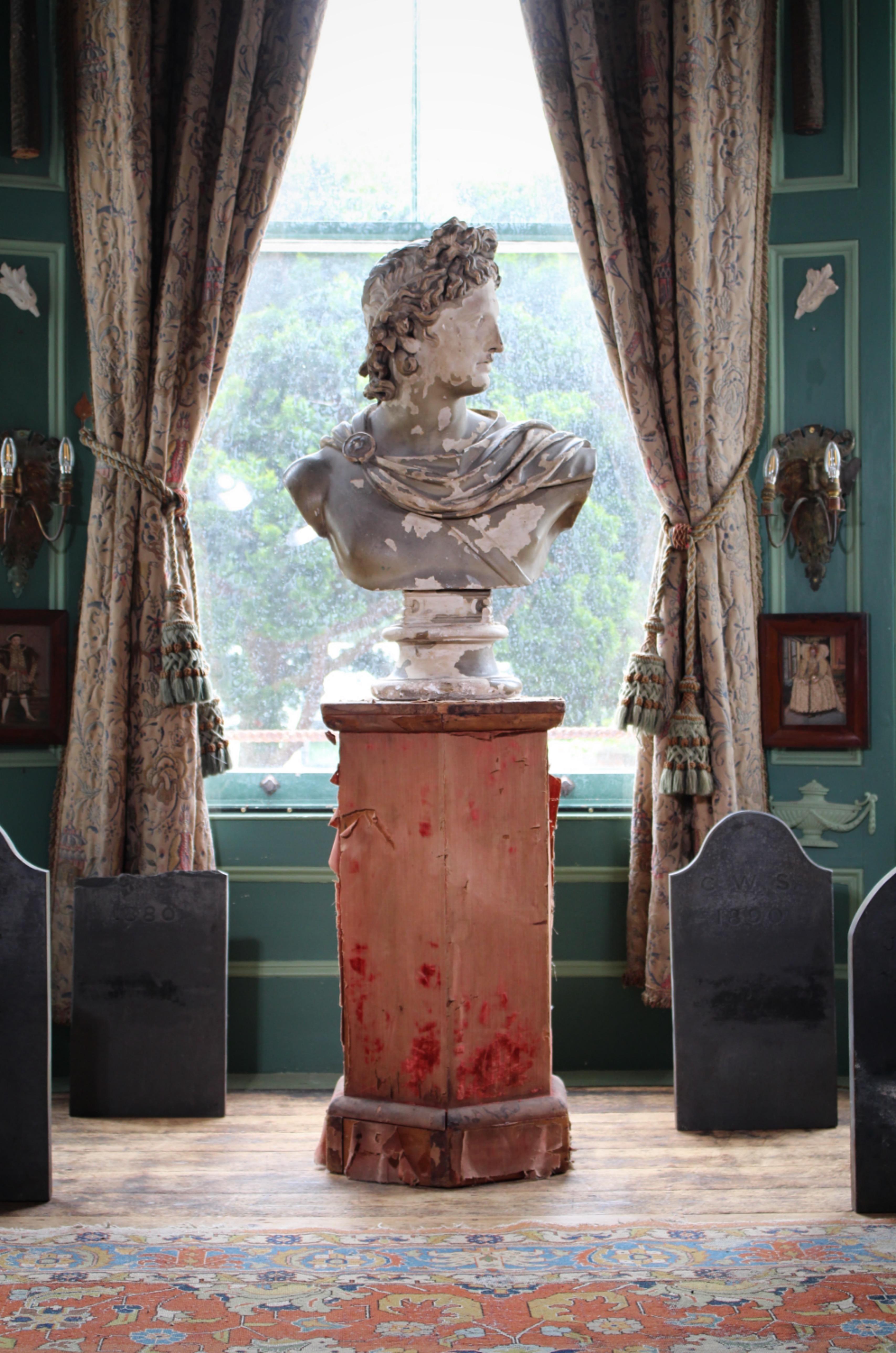 A fabulous 19th century oversized classical plaster bust of Apollo by Louis Brugiotti of 4 Leather Lane London 1845-1885, in original untouched condition. 

89cm in height 
60cm in width 
30cm in depth 
base diameter of 28cm 

Brugiotti produced