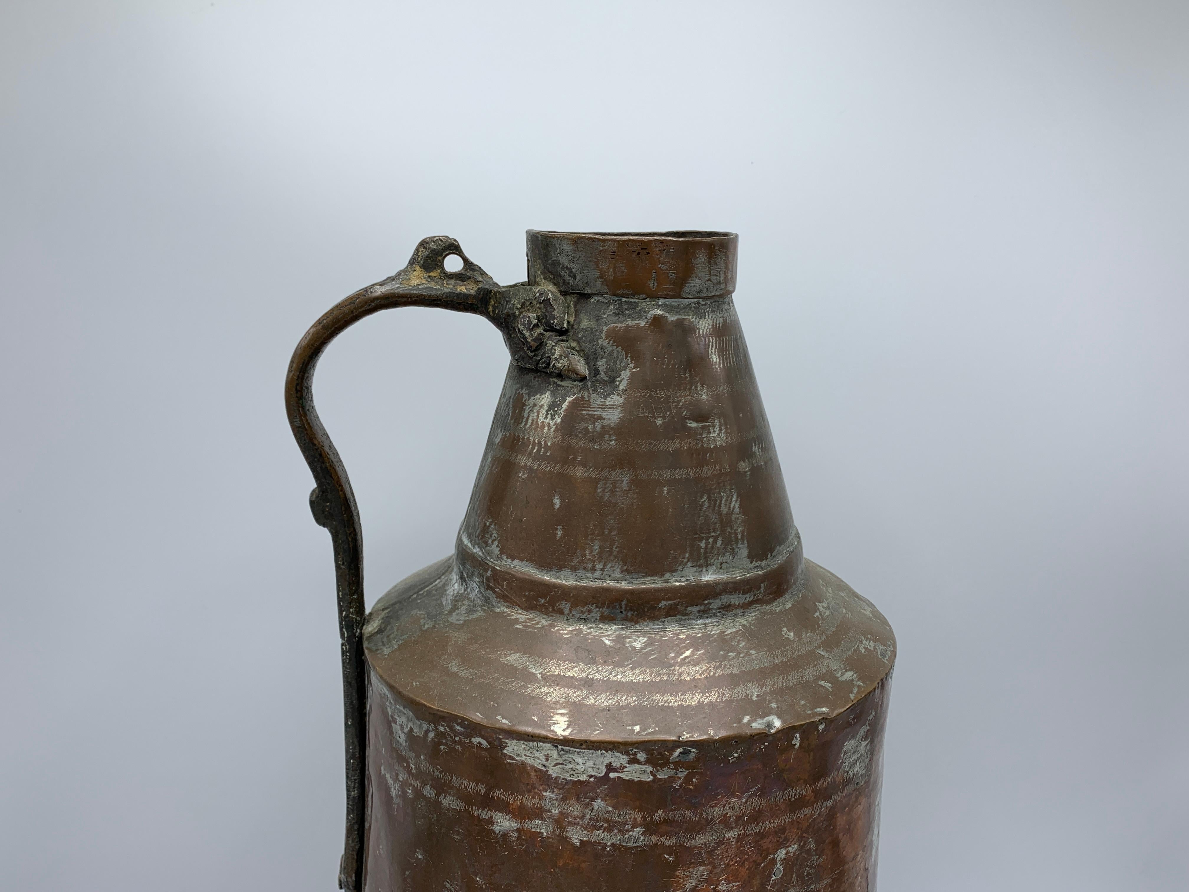 Offered is a gorgeous, late 19th century. Copper urn pitcher. The piece has a lovely, all-over patina with a timeless look. Heavy.