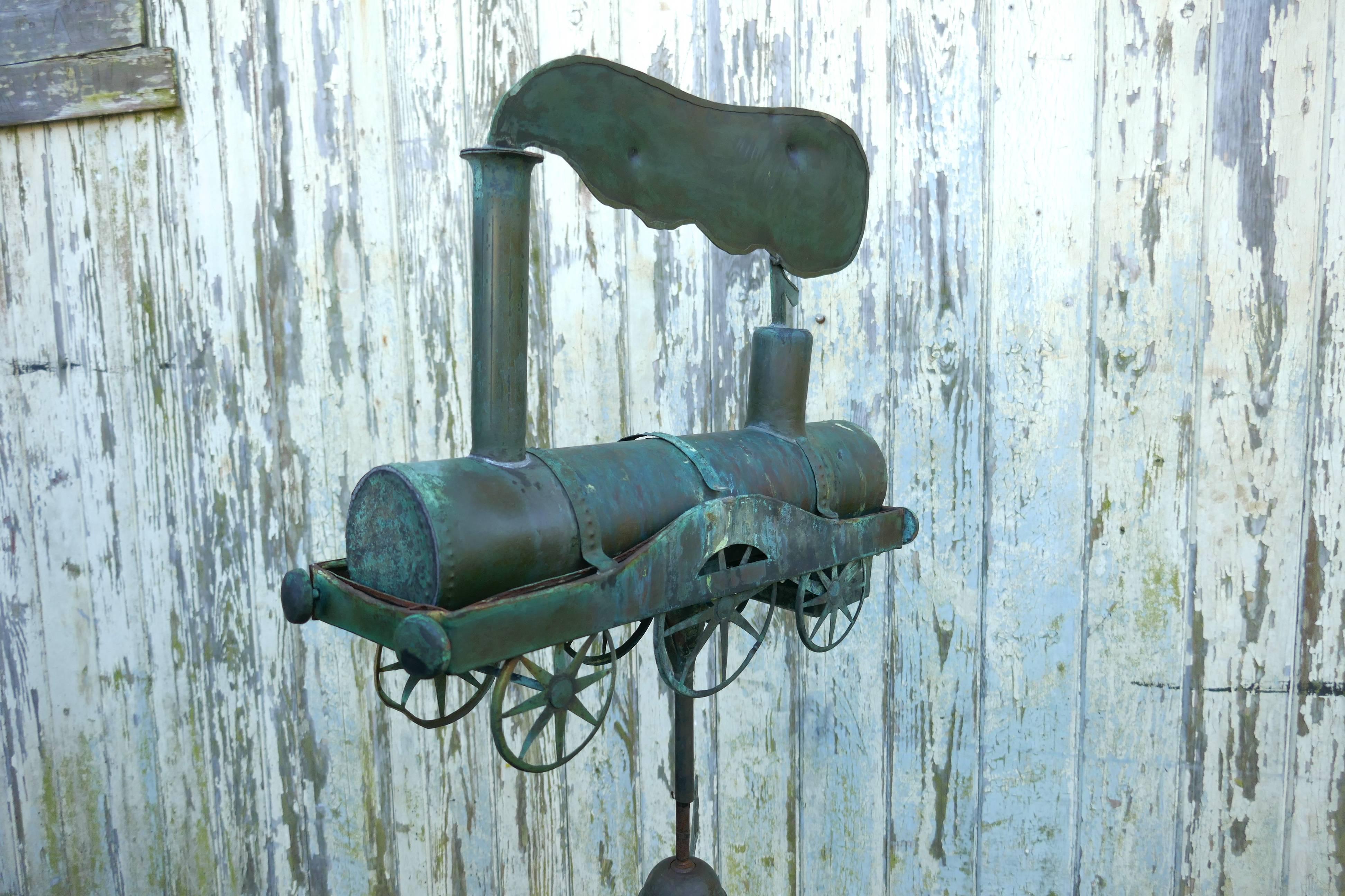 19th century Cornish copper Folk Art steam train, locomotive weathervane

The model steam train at the top of this Weathervane is hand made in Cornish copper, the Locomotive is quite detailed in its construction, it has a plume of smoke coming