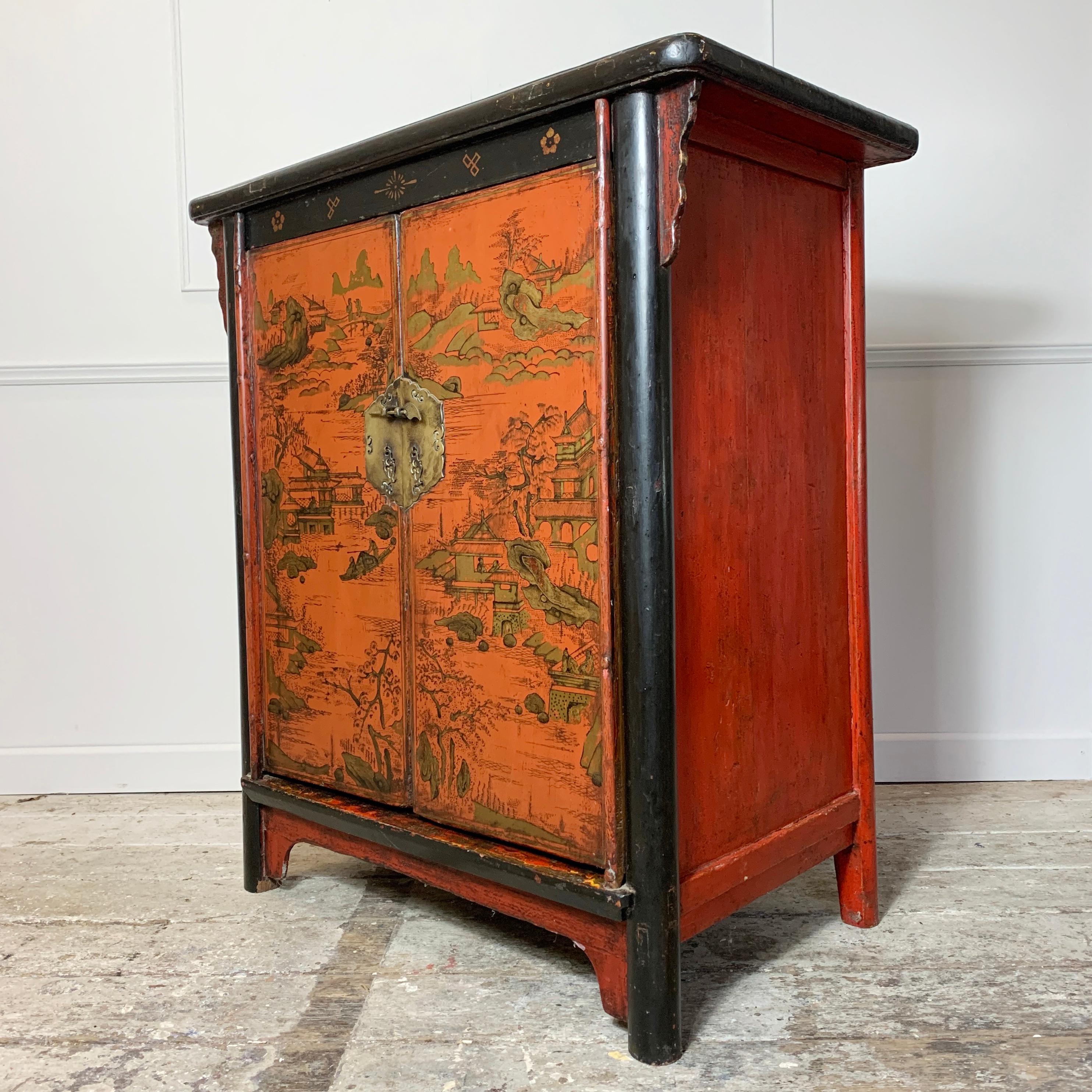 19th century crimson red on black chinoiserie cabinet
Original paintwork
The door, decorated with oriental landscapes and figures in gilt, opens to reveal a shelved interior

Dating from the latter half of the 19th century

Original brass locking