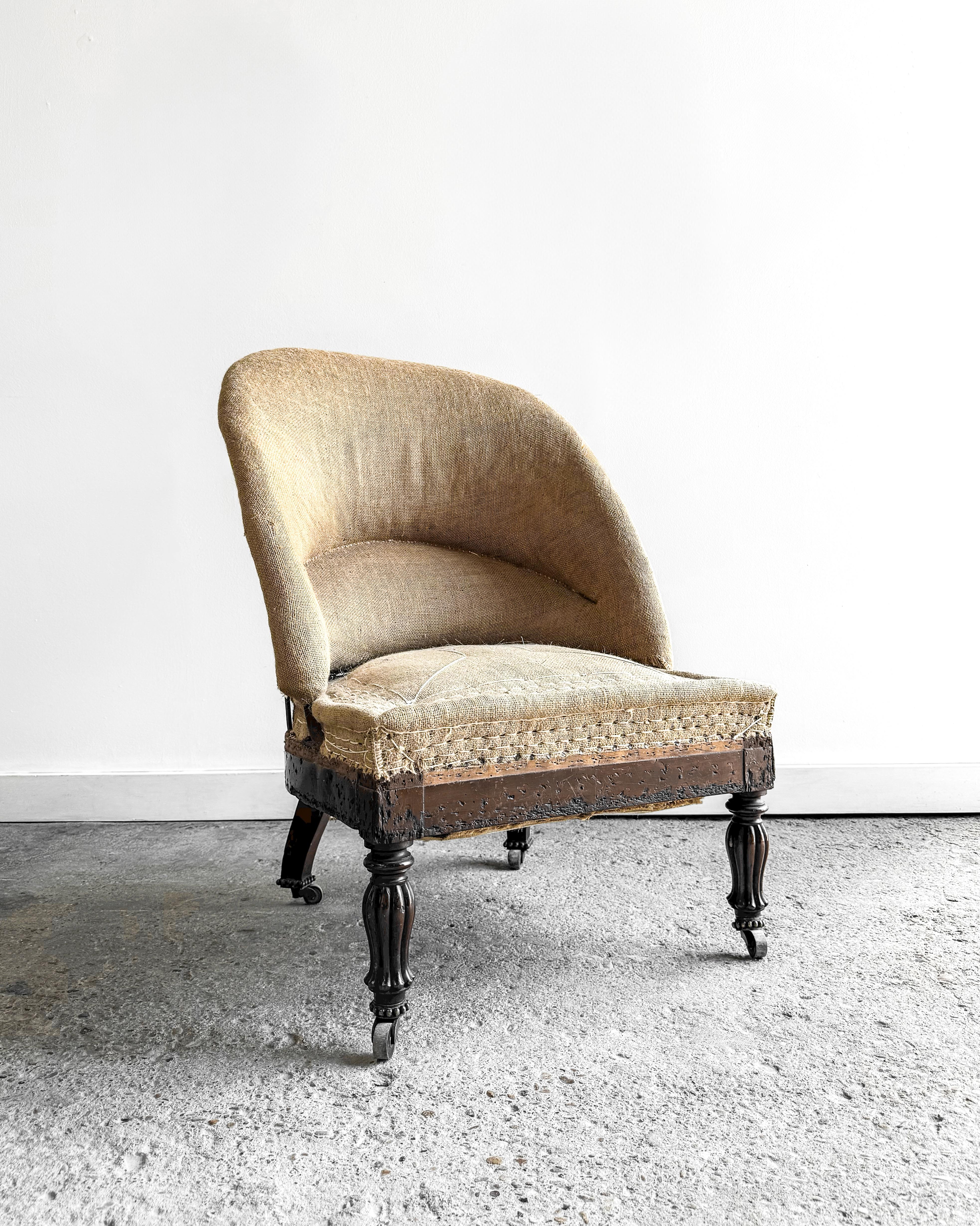 A late 19th-century French Napoleon III chair that embodies elegance and historical charm. Crafted with a solid wood frame and an iron back support, its graceful barrel-shaped back offers both style and comfort. 

Sitting low to the ground, the