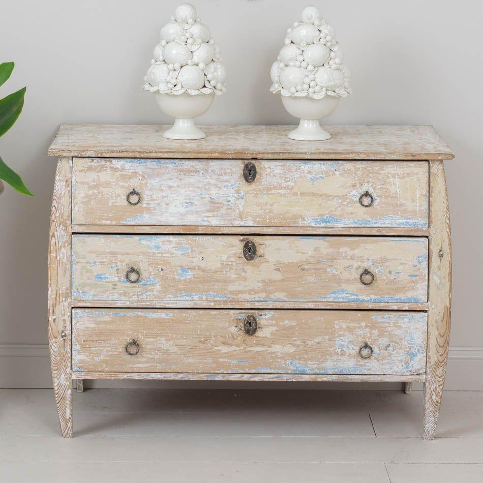 A rare 19th century Dutch commode from the 19th century in original natural patina with traces of blue paint.  Subtle Bombay form with shaped legs. Original hardware. Circa 1870.
