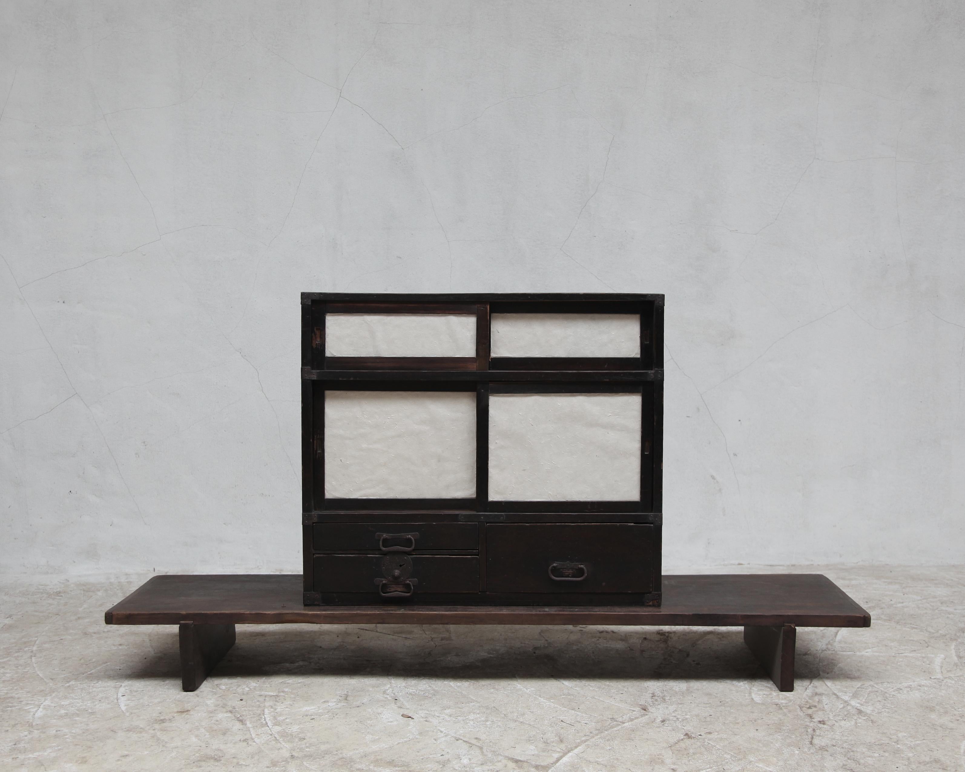 An early 19th C. Meiji period paper tansu.

Heavily patinated Japanese pine & cedar.

two sets of sliding doors with plenty of drawers.

-

We offer free shipping to the USA/Canada through Fedex with this item.