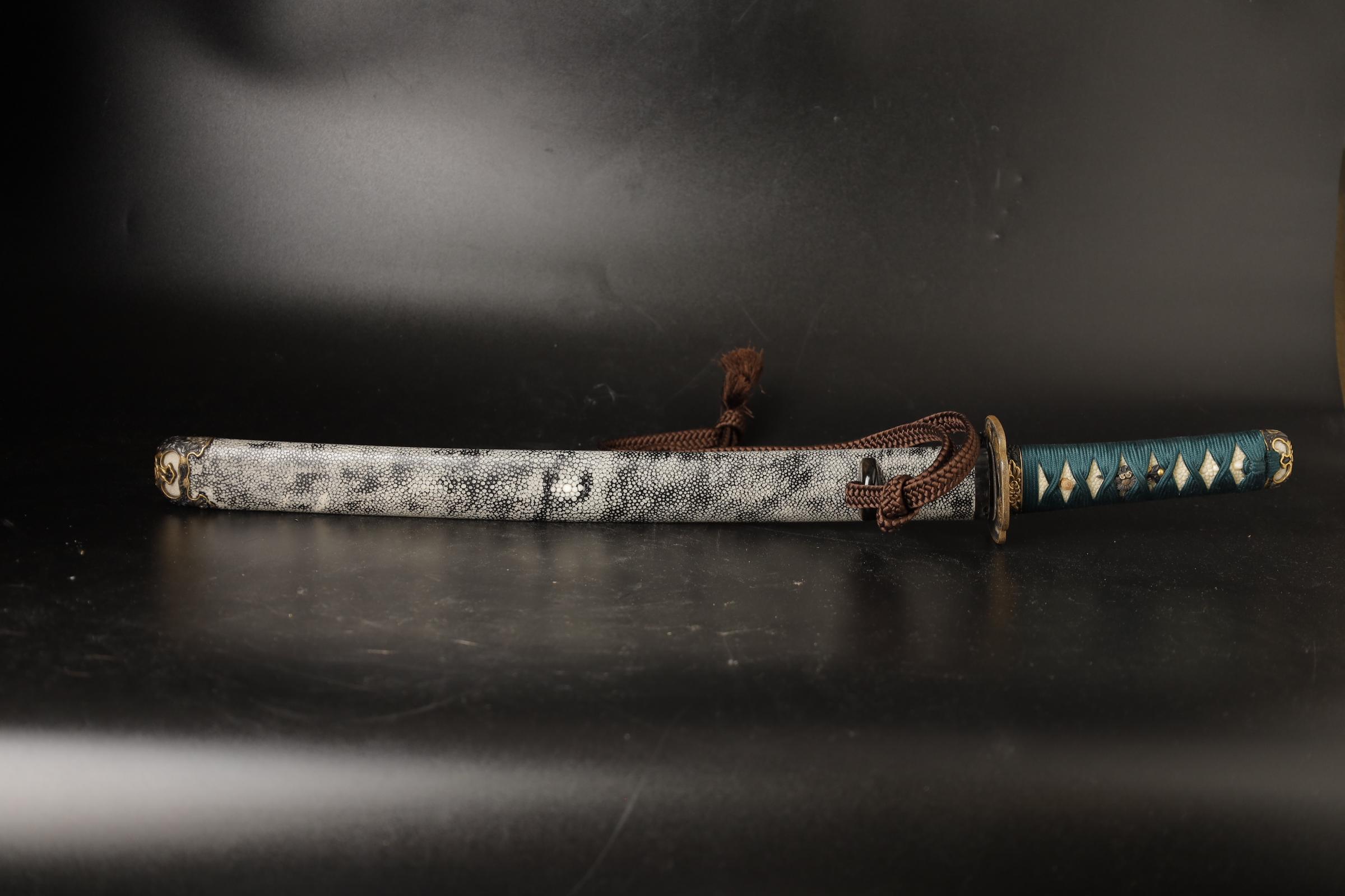 A remarkable piece of Japanese history, a fine Wakizashi Samurai short sword scabbard with blade. This exceptional piece, hails from the illustrious end of Edo- beginning of Meiji period, specifically the 19th century. 

Crafted with meticulous