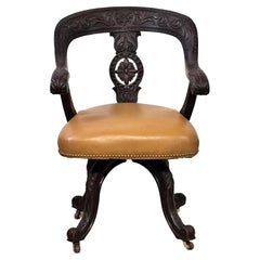 Silla de oficina de roble americano del s. XIX elaboradamente tallada c. 1895