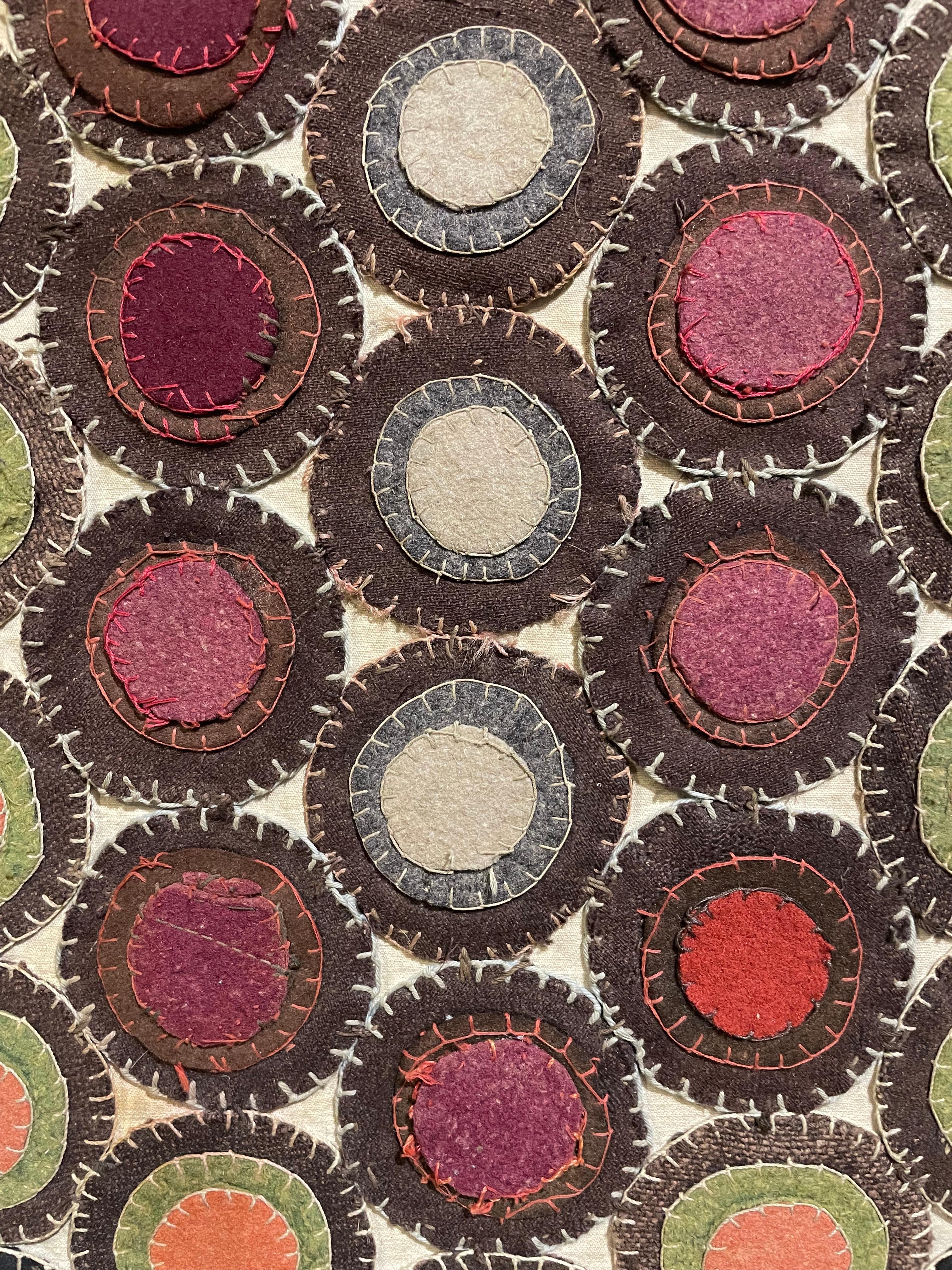 American 19th Century, Elongated Hexagonal Appliqué Penny Rug, Mounted for Hanging For Sale