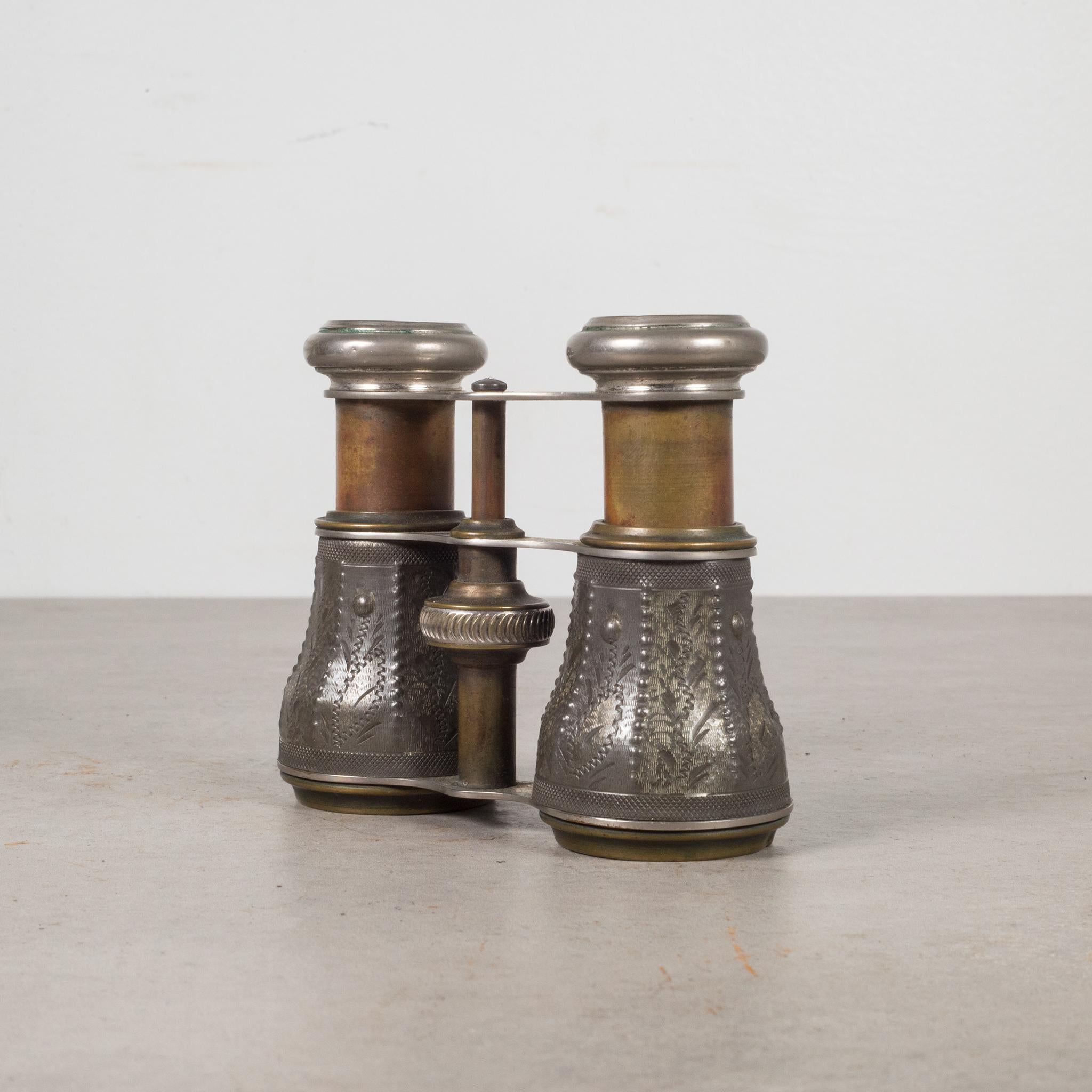 About

This is an original pair of brass plated binoculars with embossed pewter barrels. 
