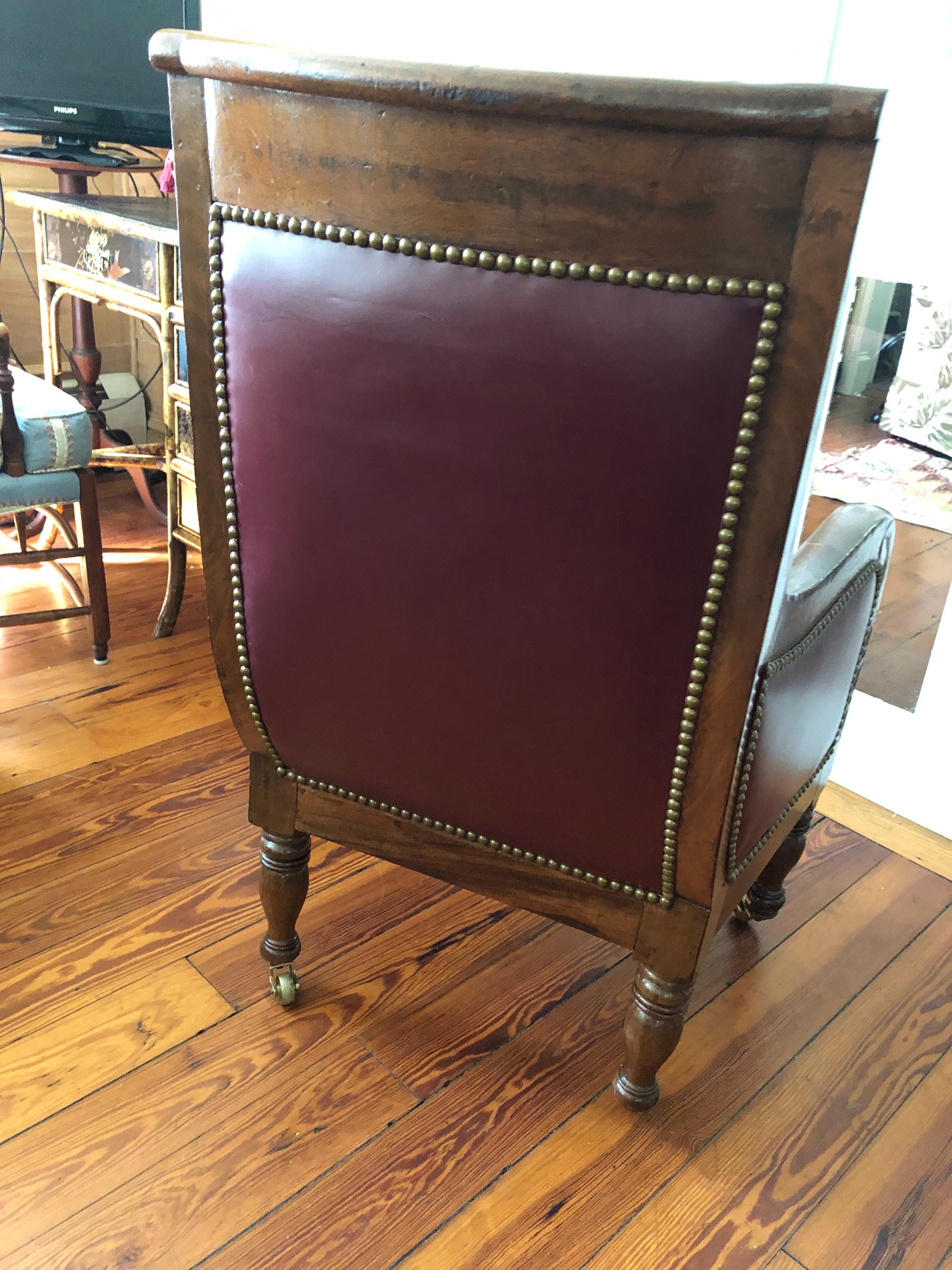 European Mahogany 19th Century Empire Library Chair on Brass Casters For Sale
