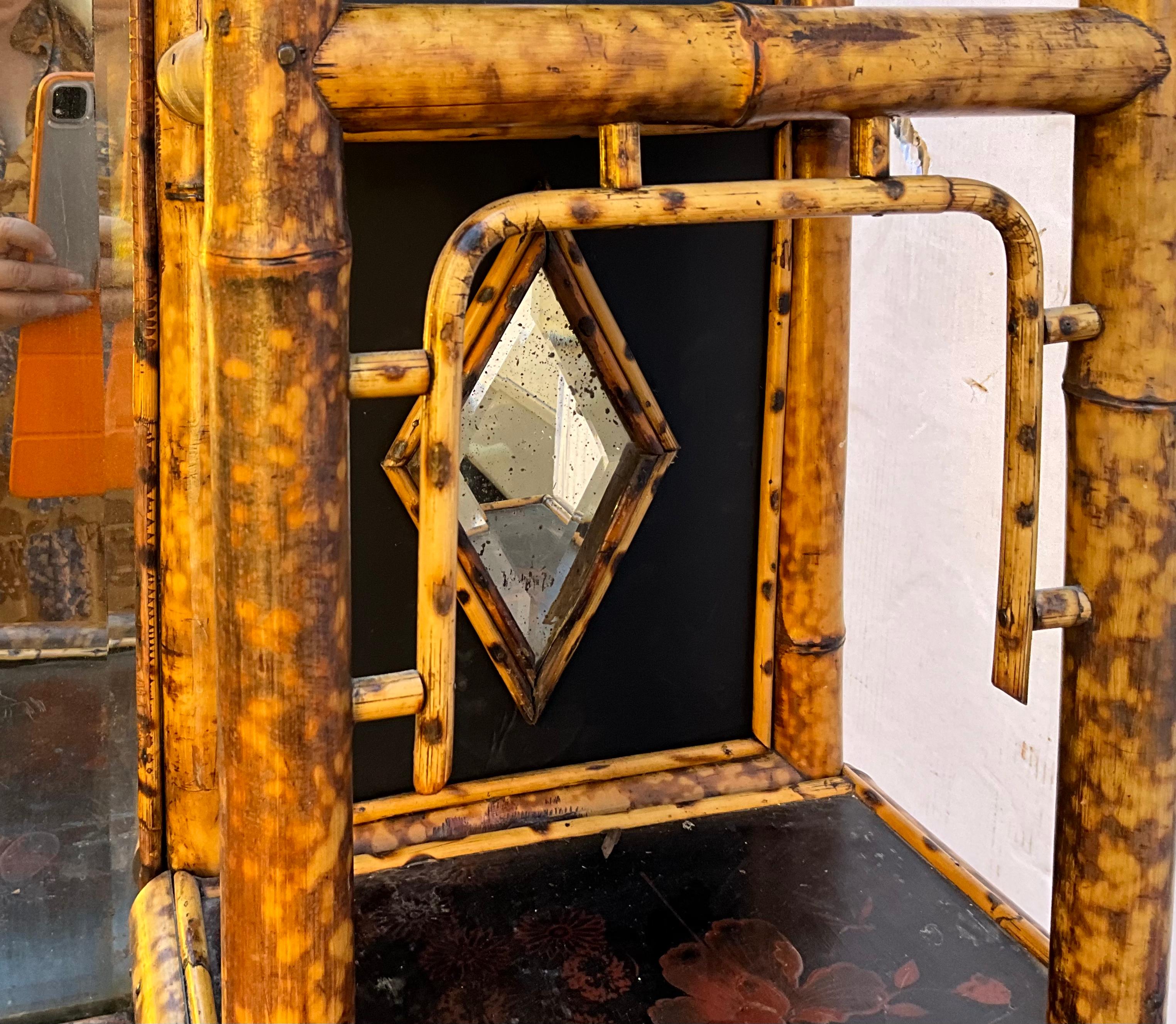 This is a show stopper! This is a 19th century English burnt bamboo and Japanned lacquer cabinet. This could work in a bath or hall or kitchen or just about any where! This piece is a rare find! It has general age wear typical of burnt bamboo from