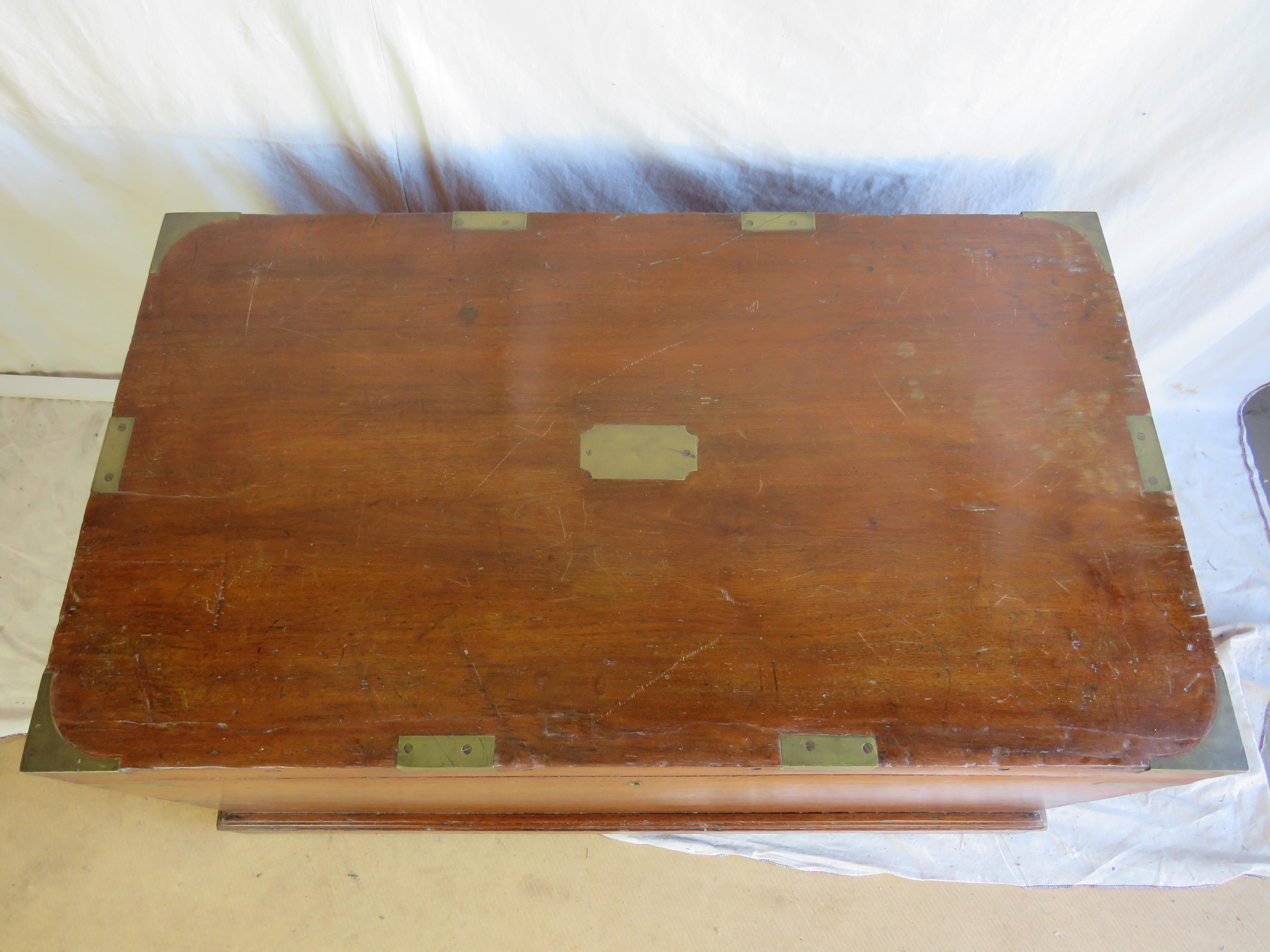 Lovely 19th century Campaign Trunk, camphor wood construction with nice, mellow patina, bound in brass, with brass lock escutcheon embossed 