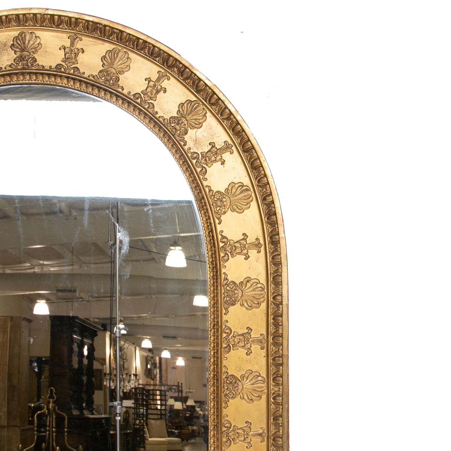 19th century English dome top gilt mirror

Great sized mirror. Giltwood with palmette and bellflower detail strong ornament outer trim. Detailed but a simple look overall.
  