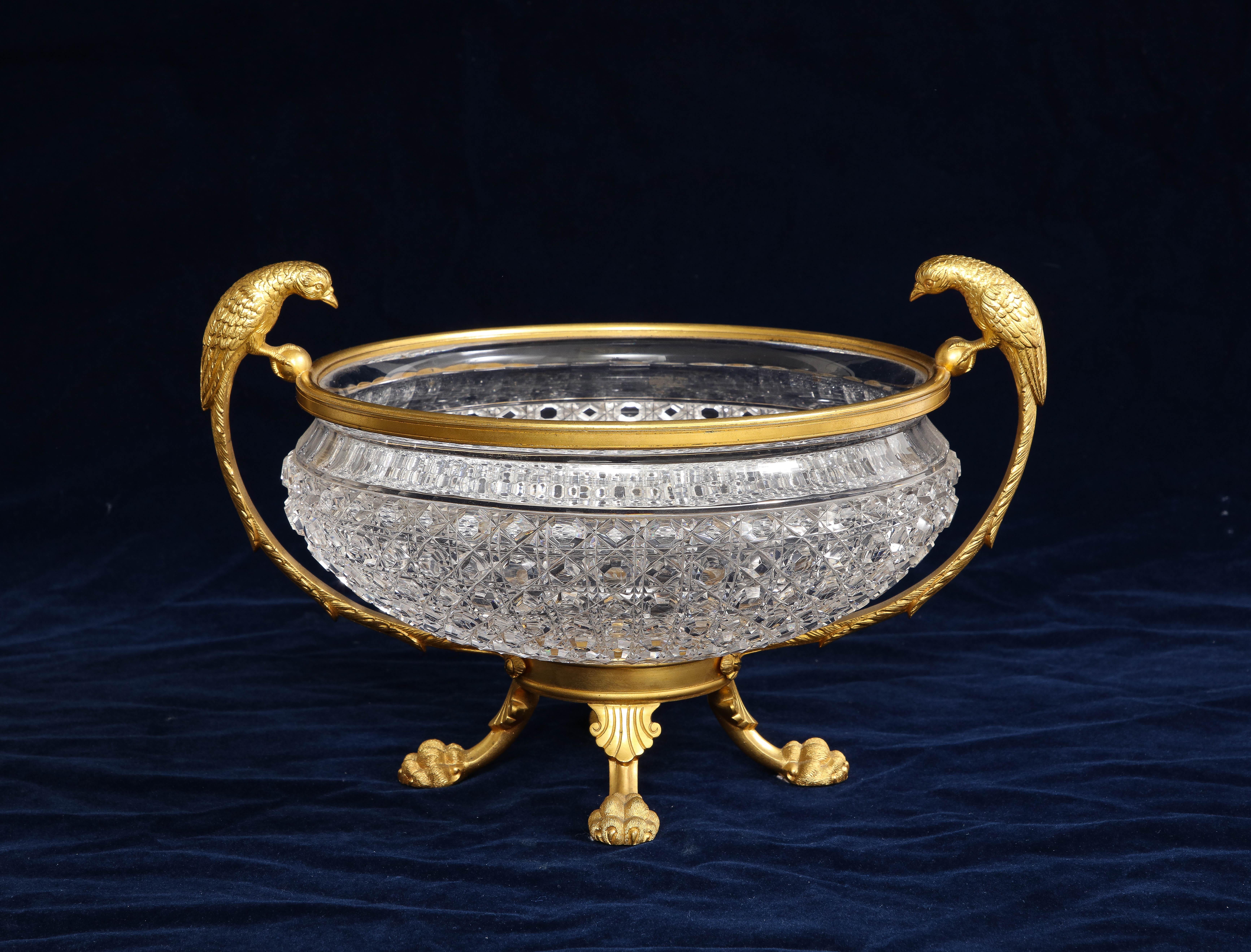 A marvelous 19th century English Dore bronze mounted crystal bowl centerpiece with dore bronze bird handles, signed on the bottom, Osler. The crystal bowl is beautifully hand carved with meticulous detail. The bowl is further surmounted on the dore