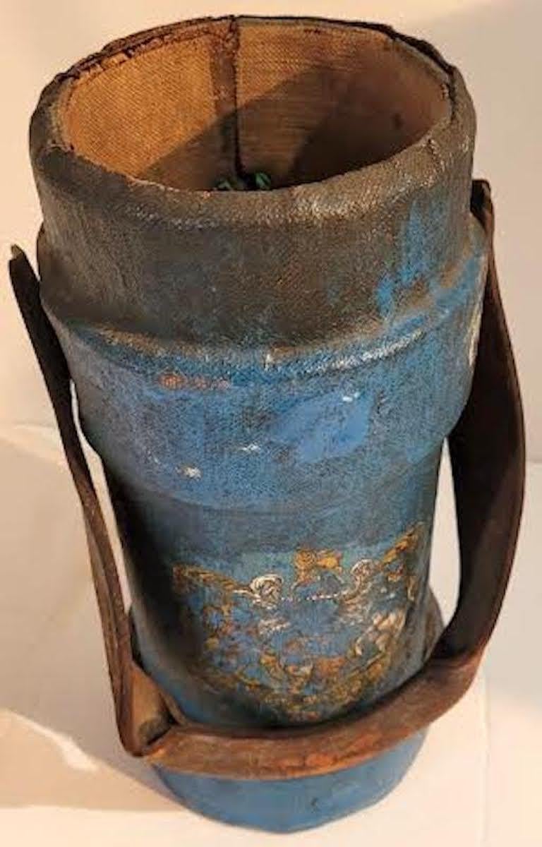 This 19th C English Field Artillery Ammunition Carrier dating about 1850 - 1860. The carrier has painted canvas over a wood frame and heavy leather carring handle. The carrier is stamped with company and regimental identifications and insignia. The